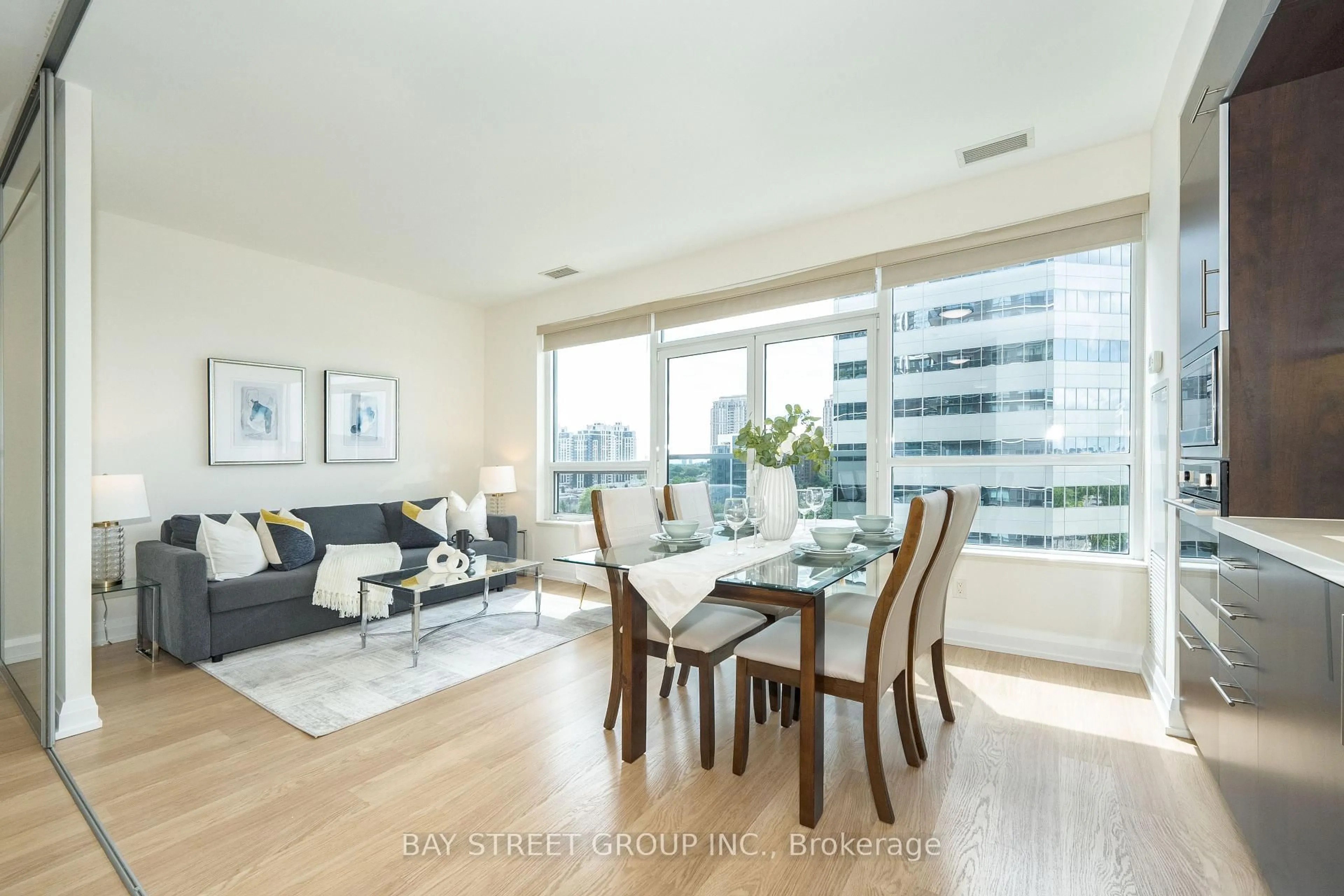 Living room with furniture, wood/laminate floor for 2 Anndale Dr #909, Toronto Ontario M2N 0G2