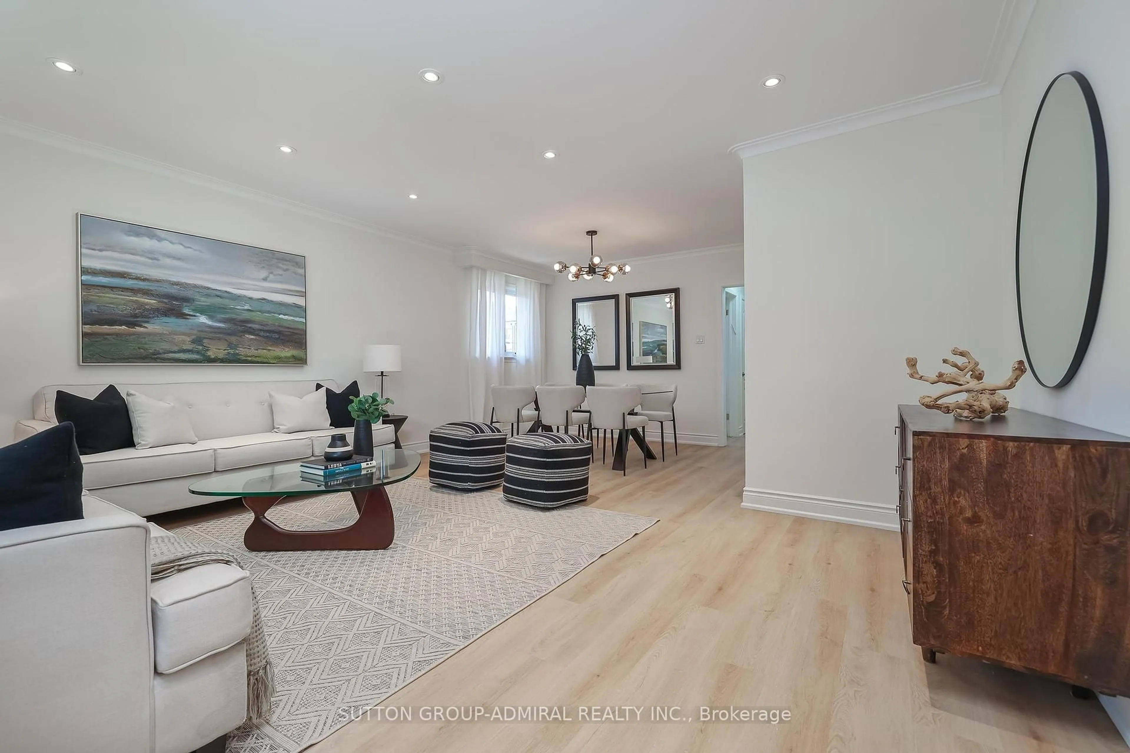 Living room with furniture, wood/laminate floor for 161 Ranee Ave, Toronto Ontario M6A 1N3