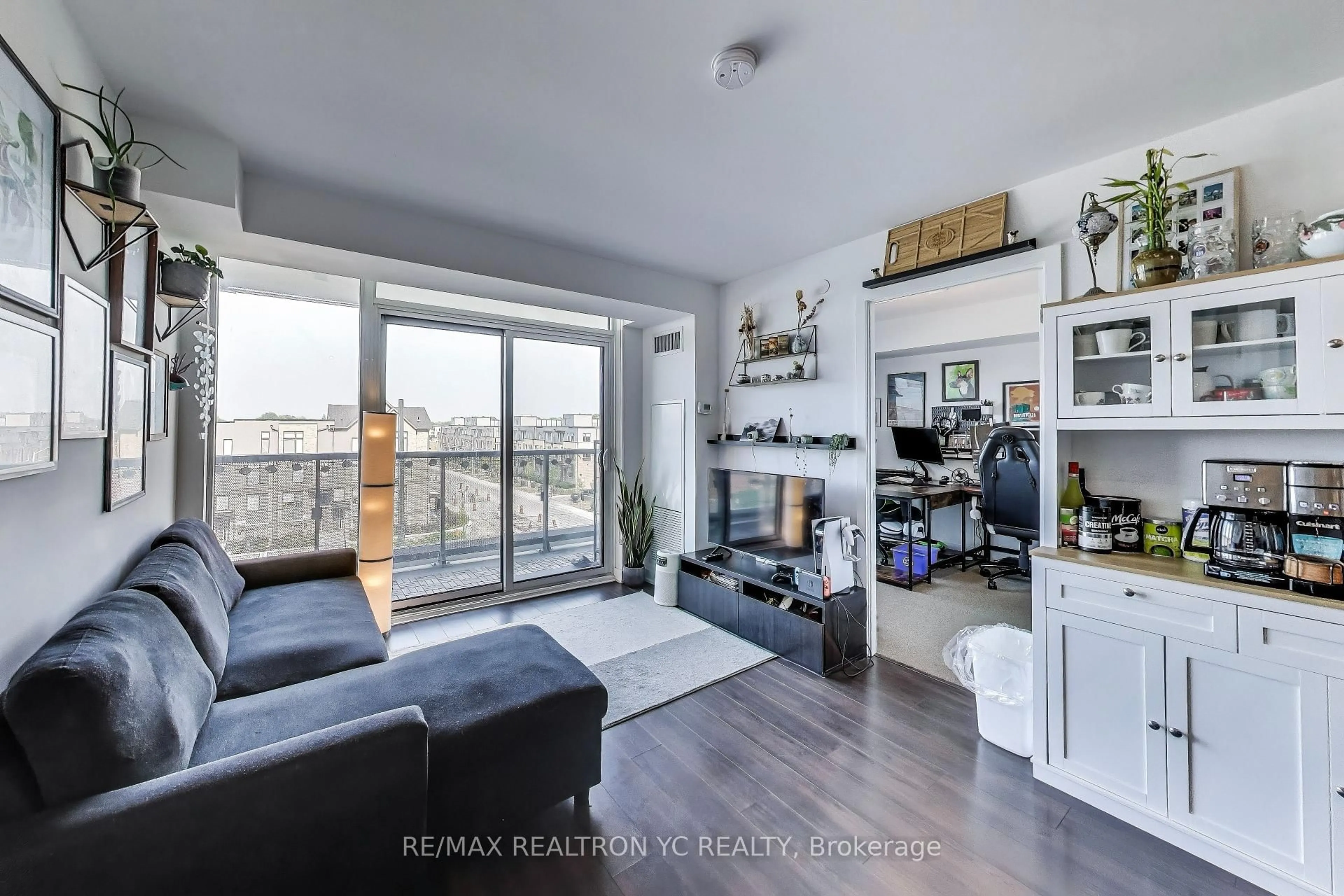 Living room with furniture, wood/laminate floor for 120 Varna Dr #520, Toronto Ontario M6A 0B3