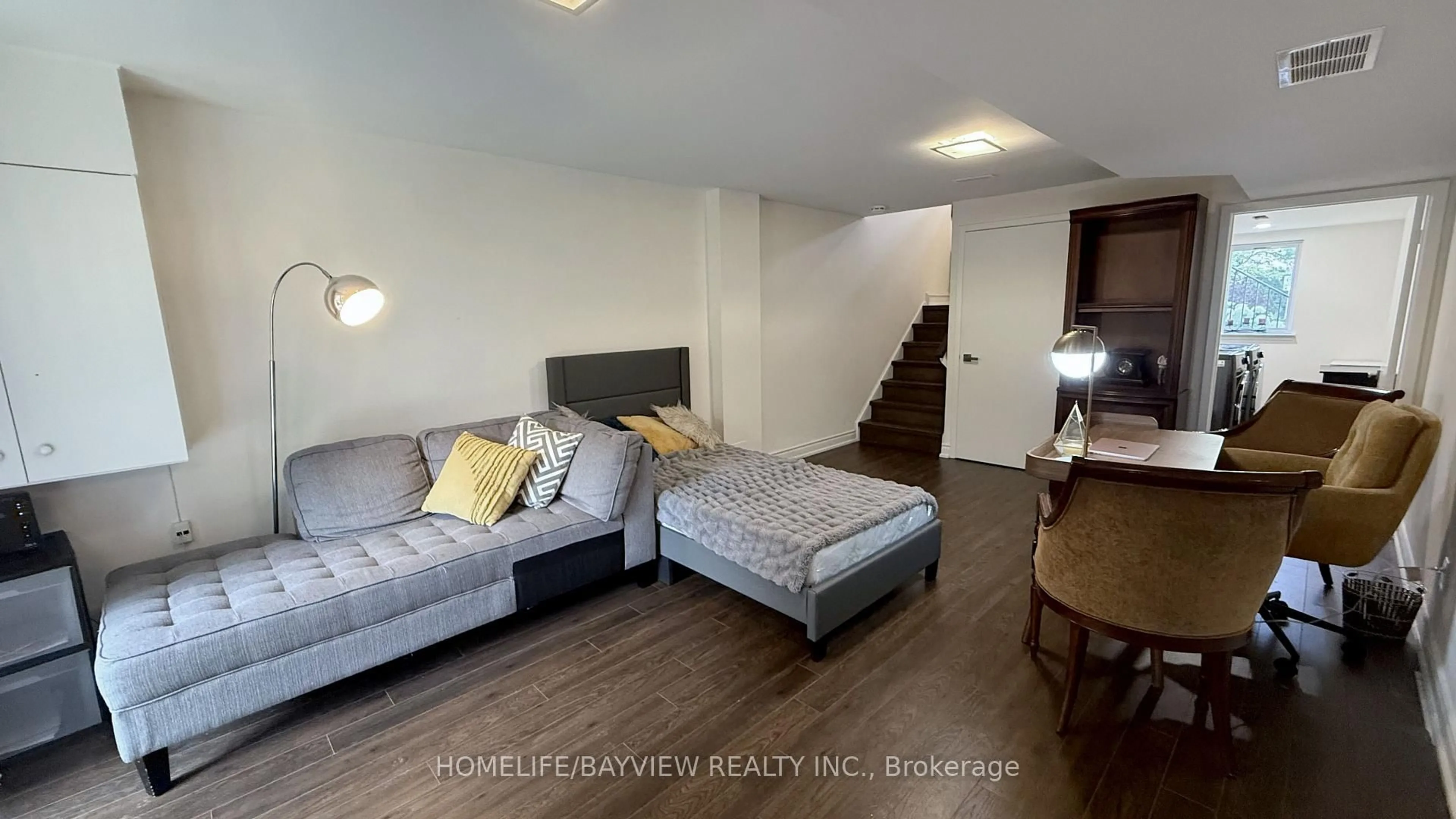 Living room with furniture, wood/laminate floor for 85 Crimson Millway, Toronto Ontario M2L 1T8