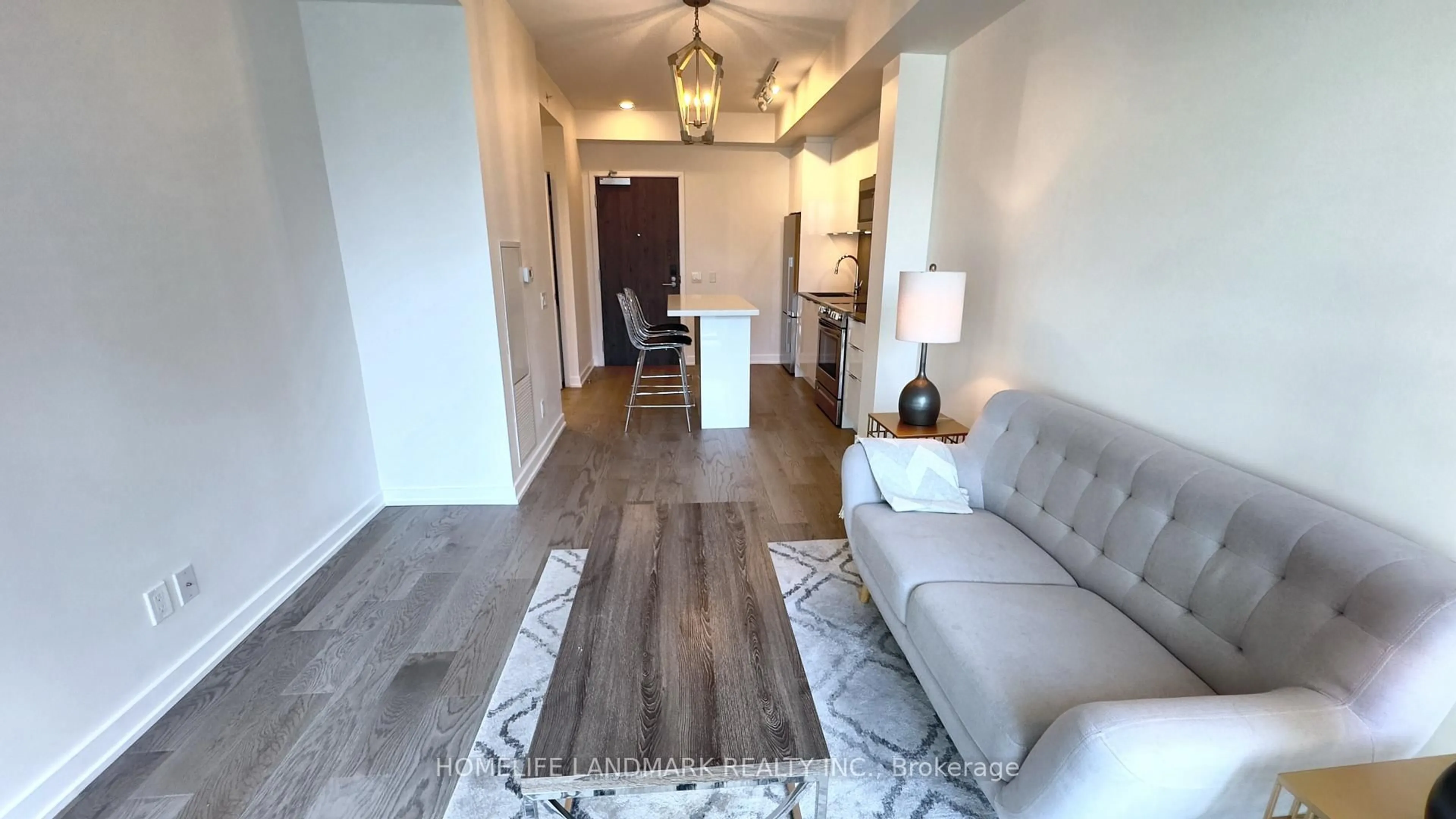 Living room with furniture, wood/laminate floor for 25 Richmond St #2707, Toronto Ontario M5C 0A6