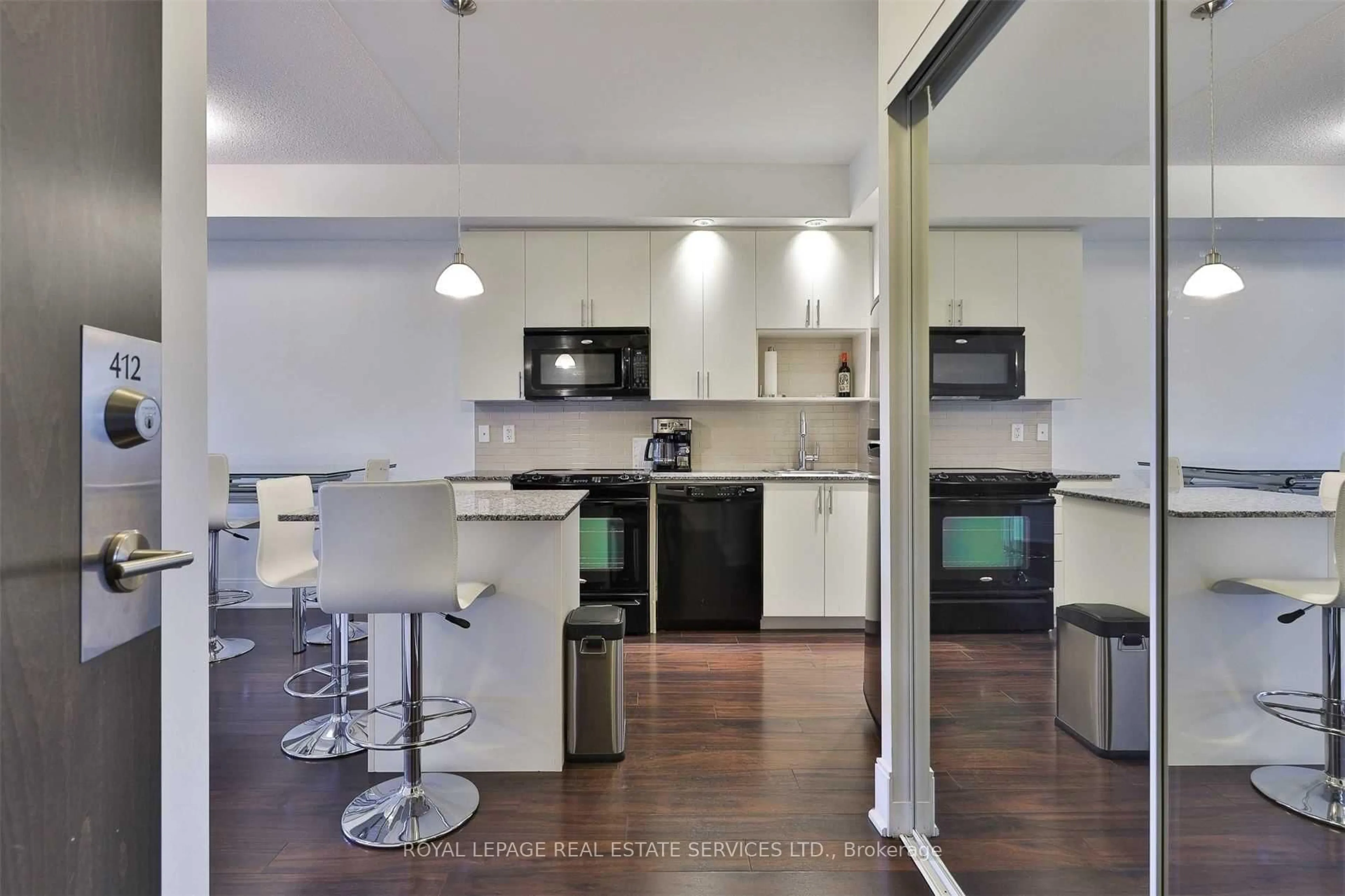 Open concept kitchen, wood/laminate floor for 181 Wynford Dr #412, Toronto Ontario M3C 0C6