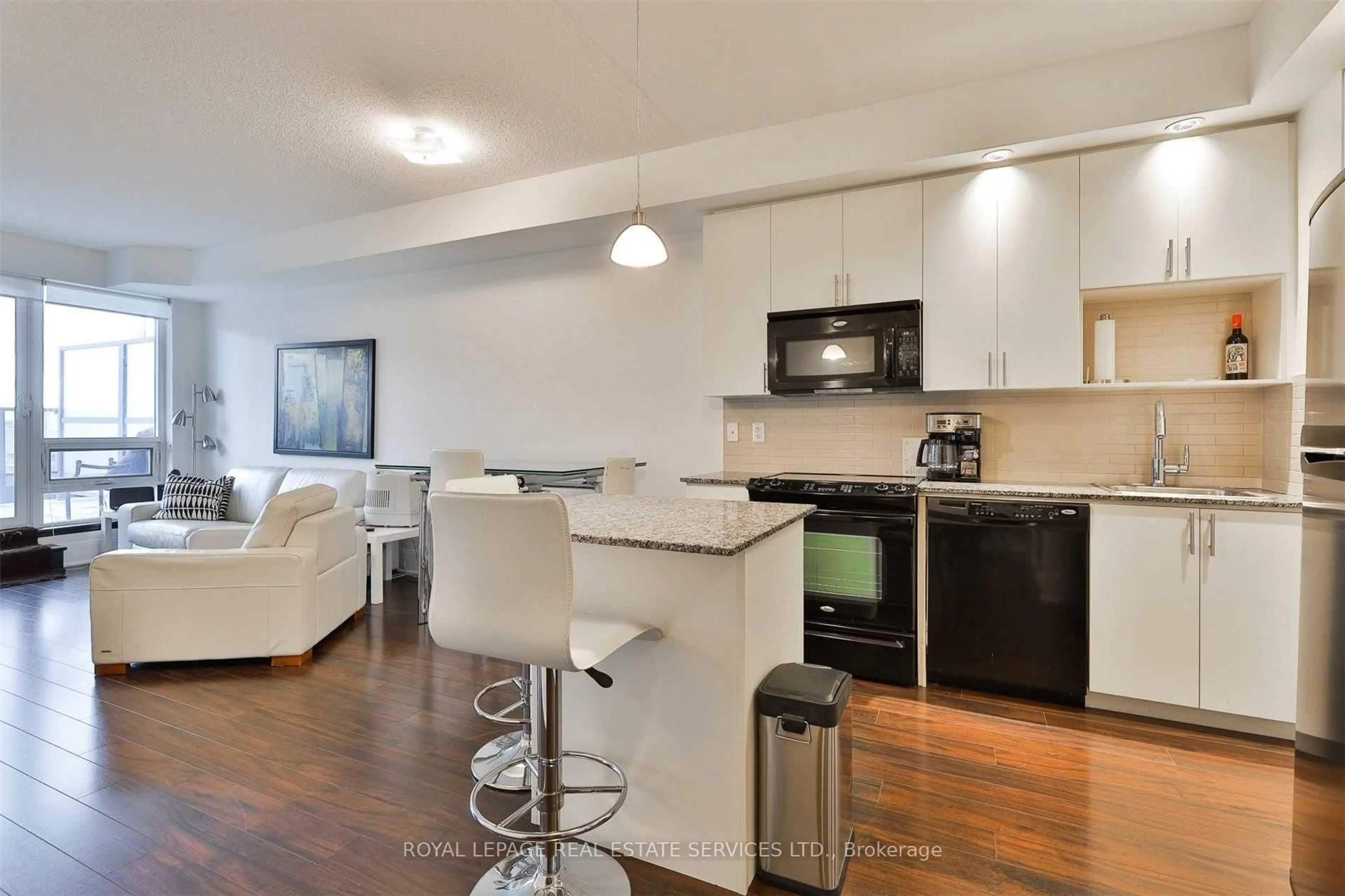 Open concept kitchen, wood/laminate floor for 181 Wynford Dr #412, Toronto Ontario M3C 0C6