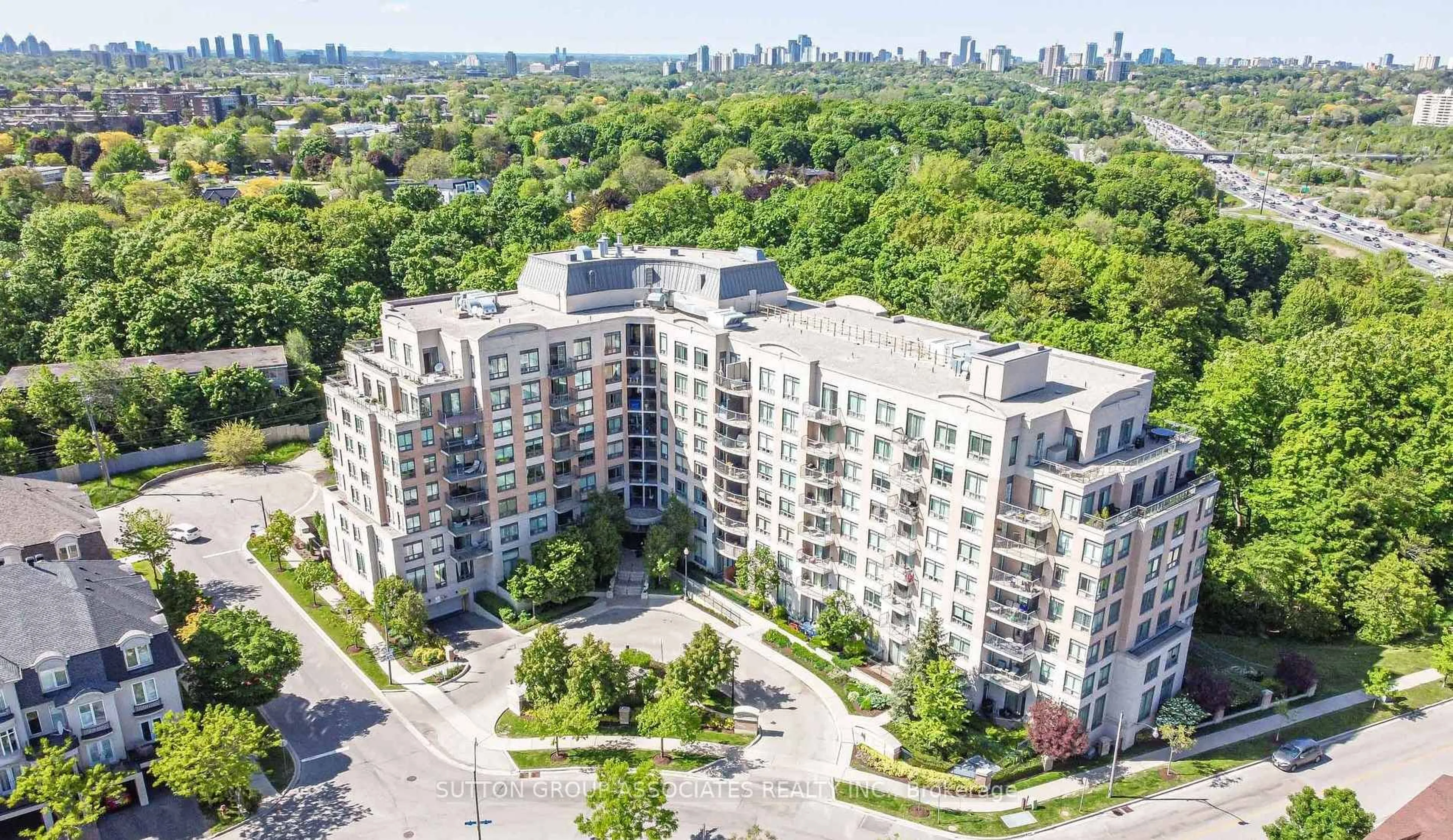 A pic from outside/outdoor area/front of a property/back of a property/a pic from drone, city buildings view from balcony for 16 Dallimore Circ #107, Toronto Ontario M3C 4C4
