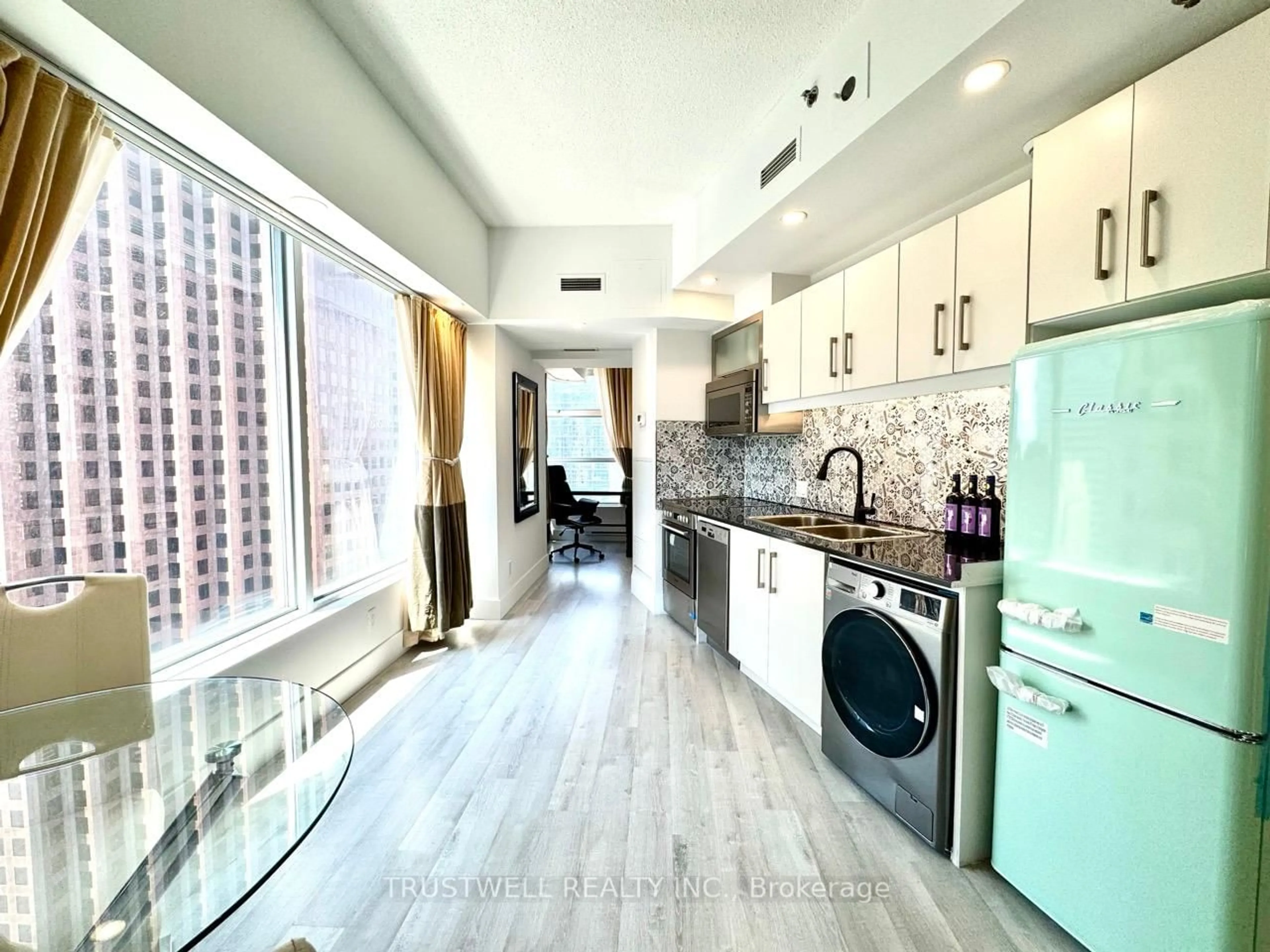 Kitchen with laundary machines, unknown for 1 King St #2901, Toronto Ontario M5H 1A1