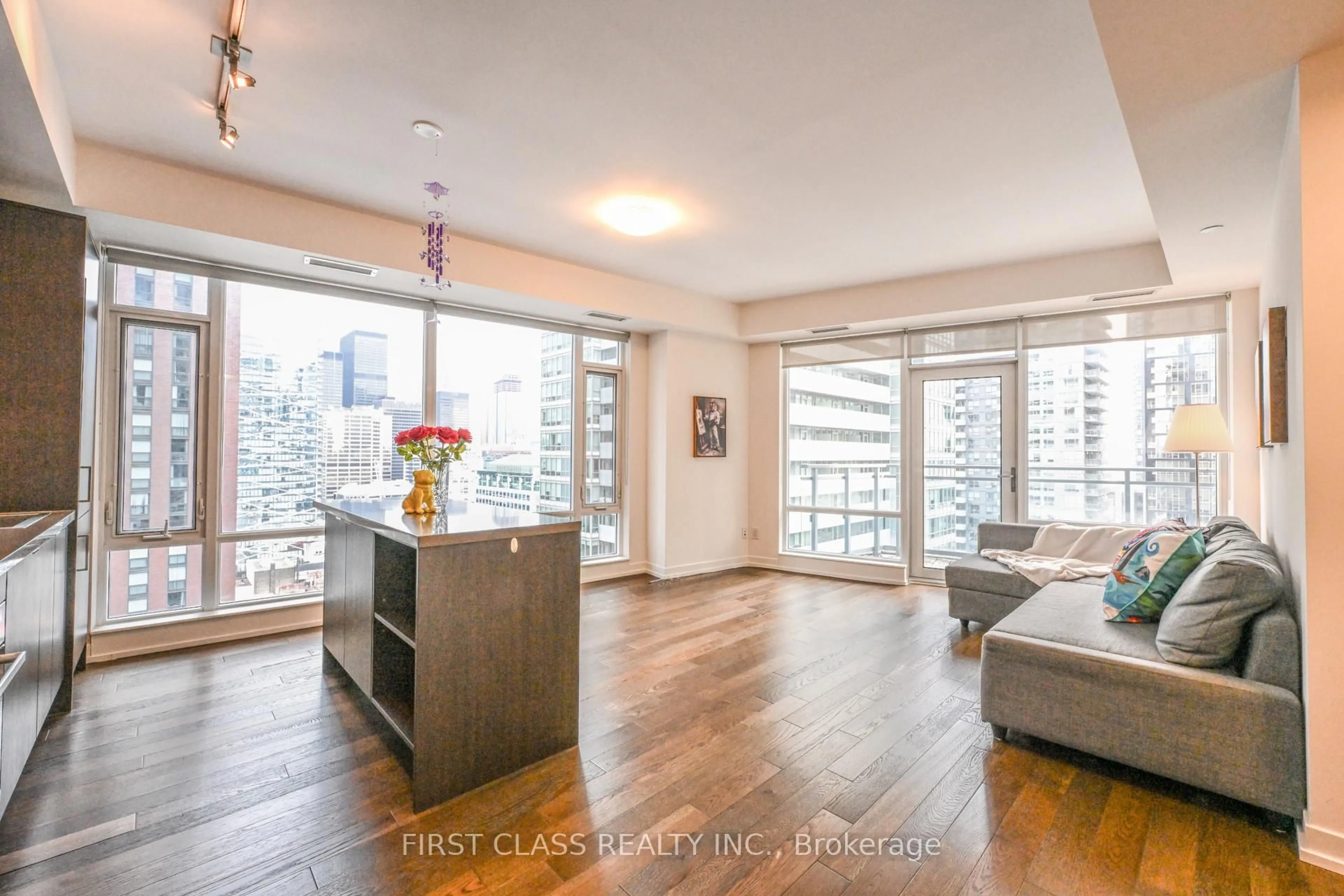 Living room with furniture, wood/laminate floor for 21 Widmer St #2109, Toronto Ontario M5V 2E8