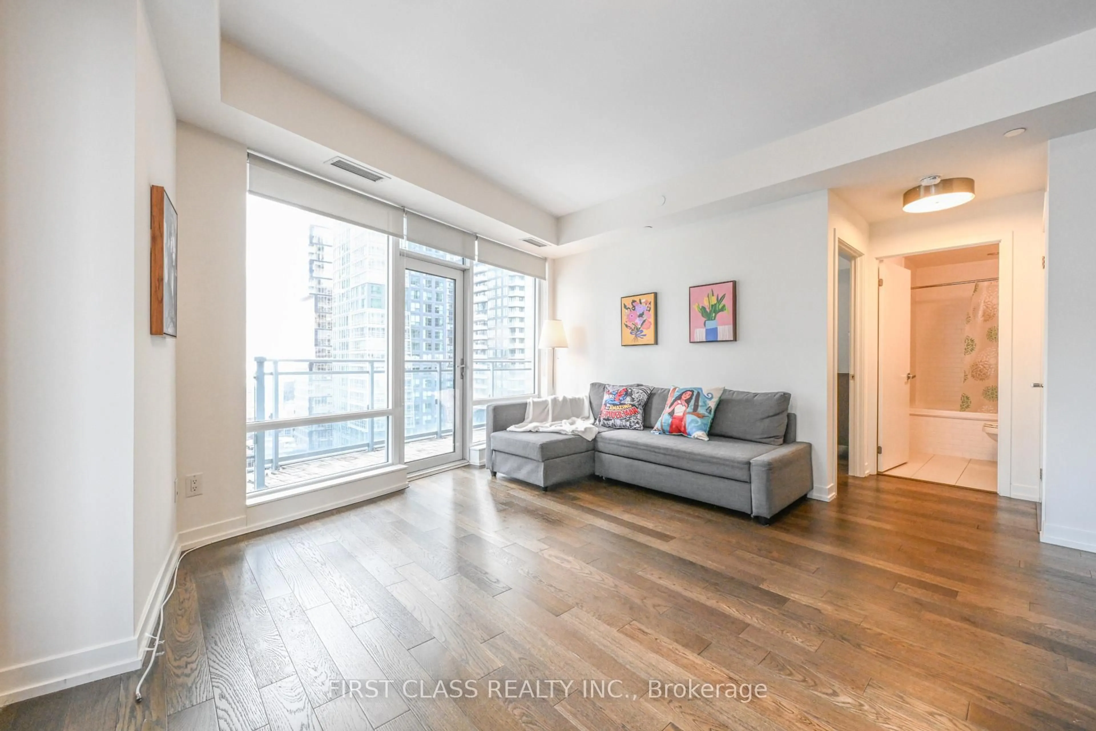 Living room with furniture, wood/laminate floor for 21 Widmer St #2109, Toronto Ontario M5V 2E8