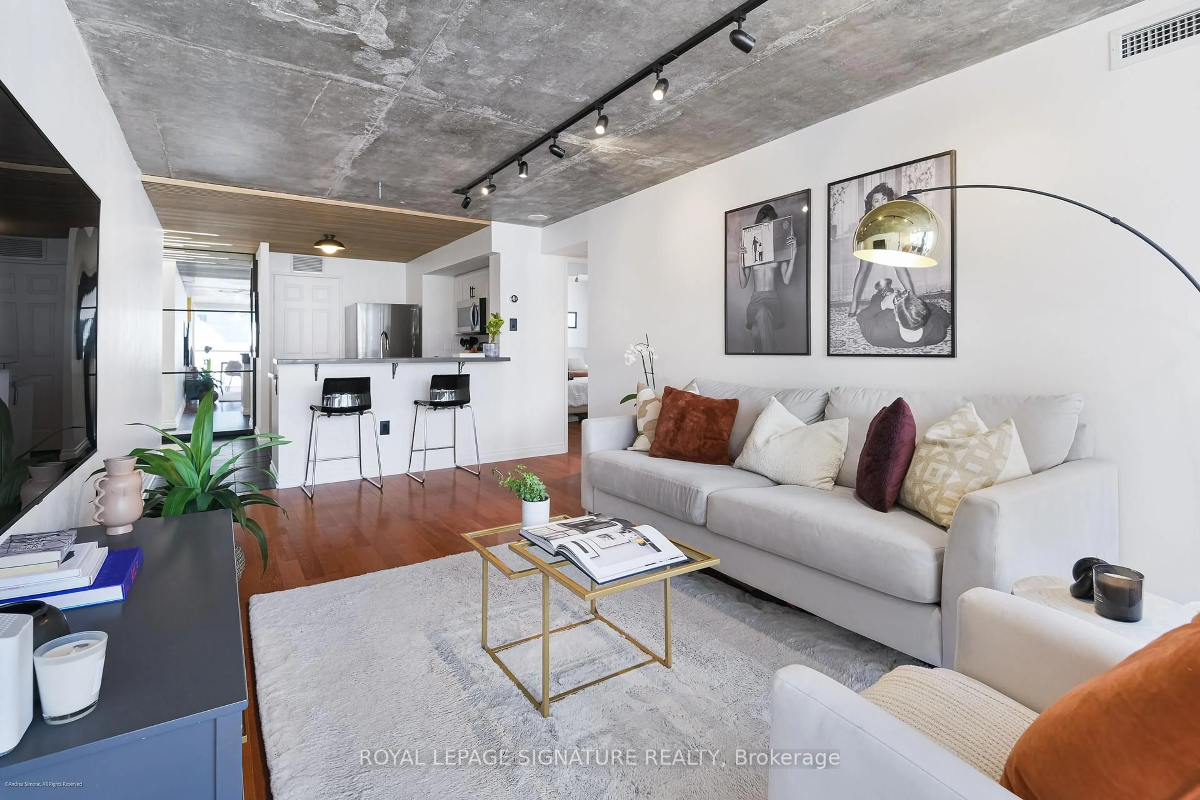 Living room with furniture, cement floor for 705 King St #804, Toronto Ontario M5V 2W8