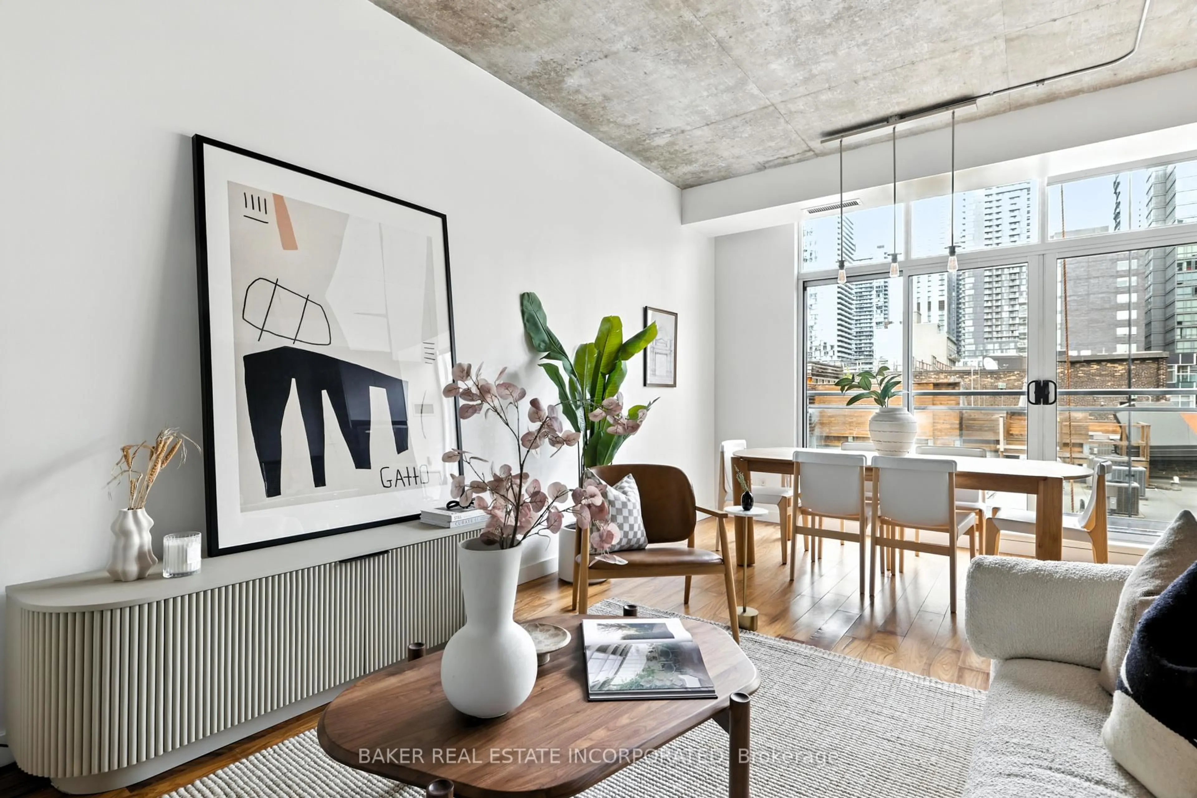 Living room with furniture, cement floor for 23 Brant St #601, Toronto Ontario M5V 2L5