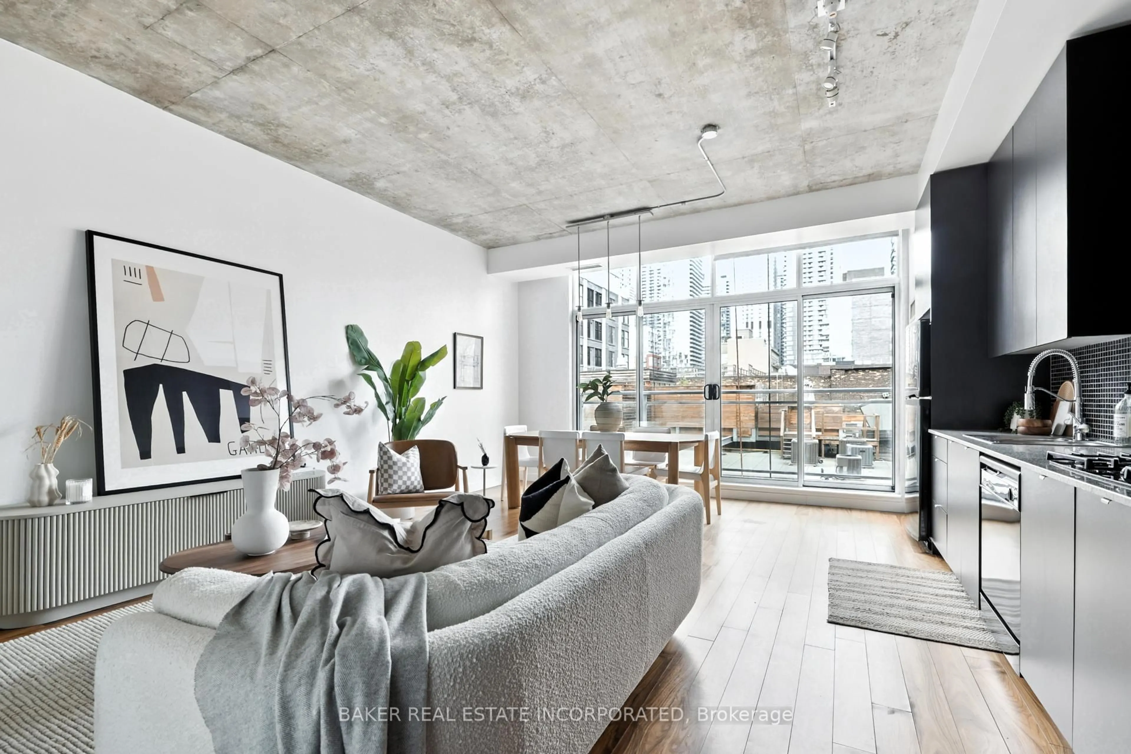 Living room with furniture, cement floor for 23 Brant St #601, Toronto Ontario M5V 2L5