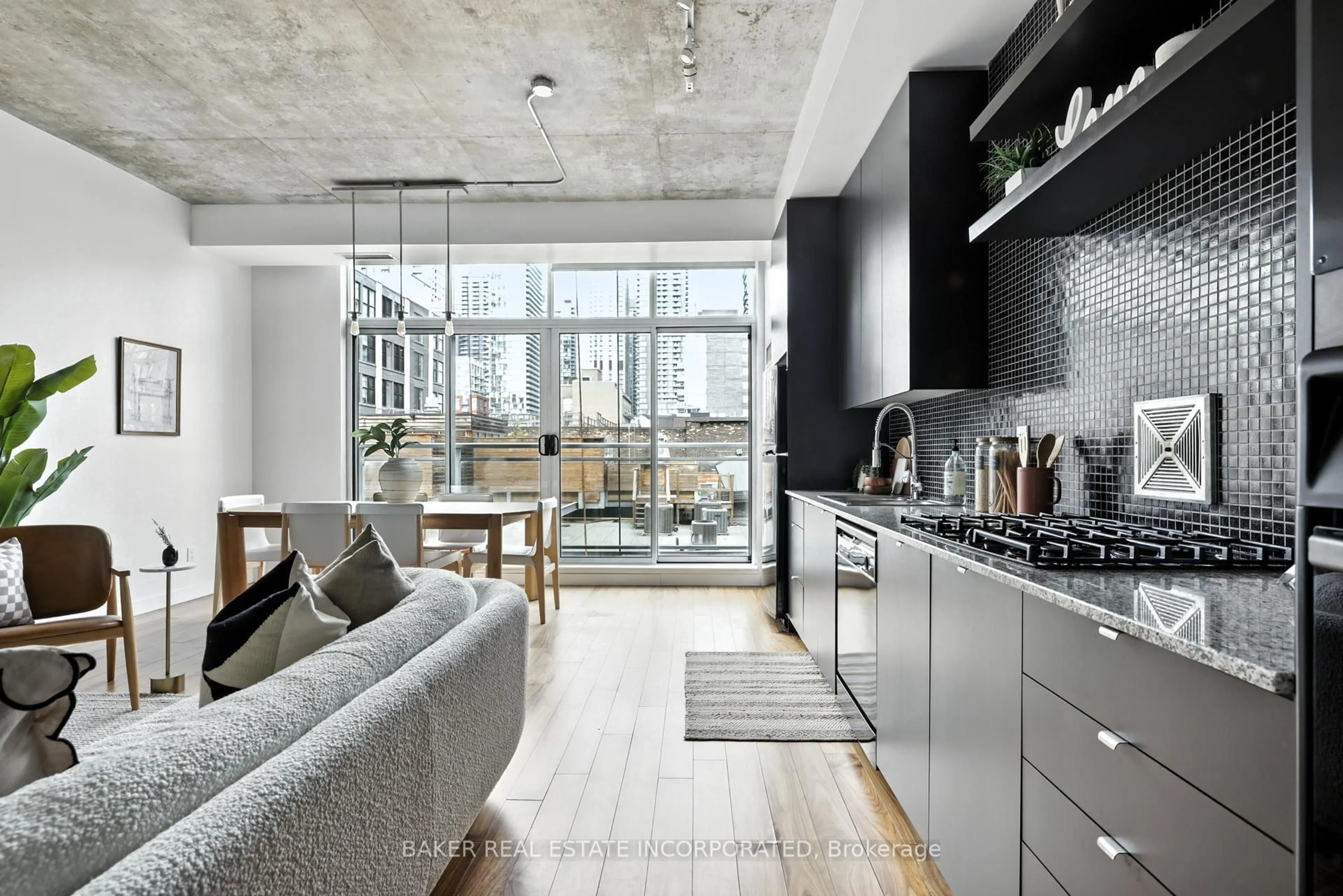 Open concept kitchen, cement floor for 23 Brant St #601, Toronto Ontario M5V 2L5