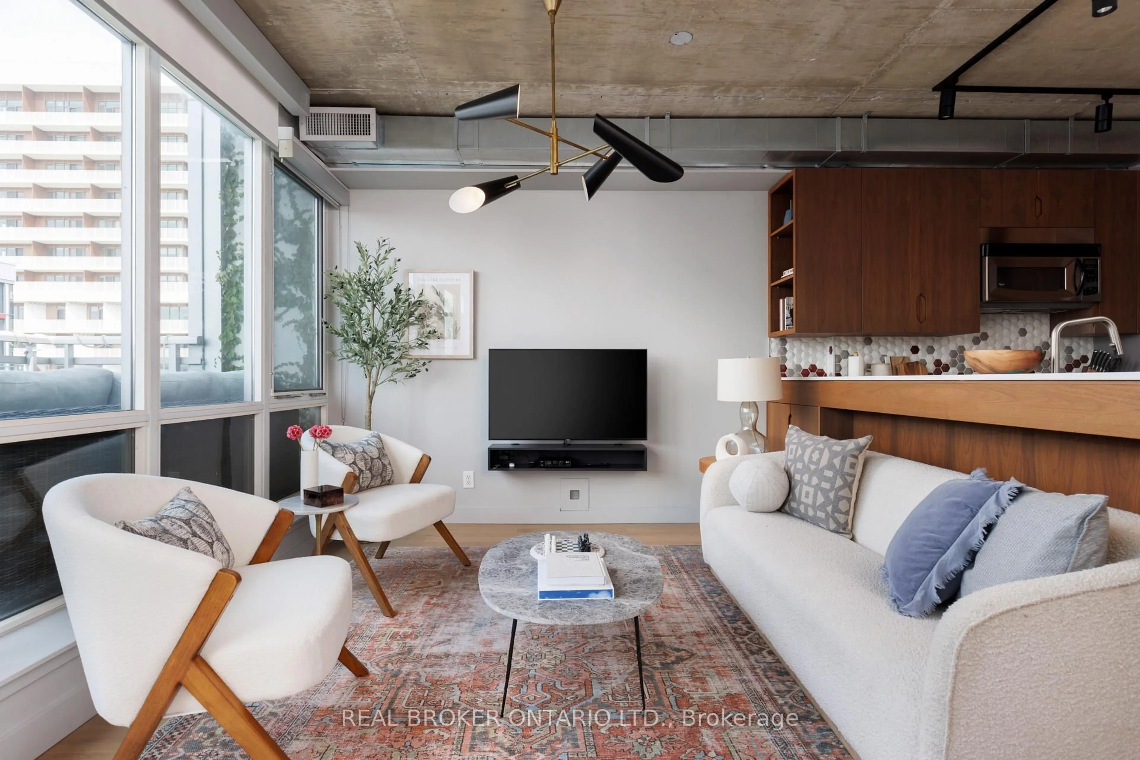 Living room with furniture, cement floor for 38 Niagara St #PH08, Toronto Ontario M5V 3X1