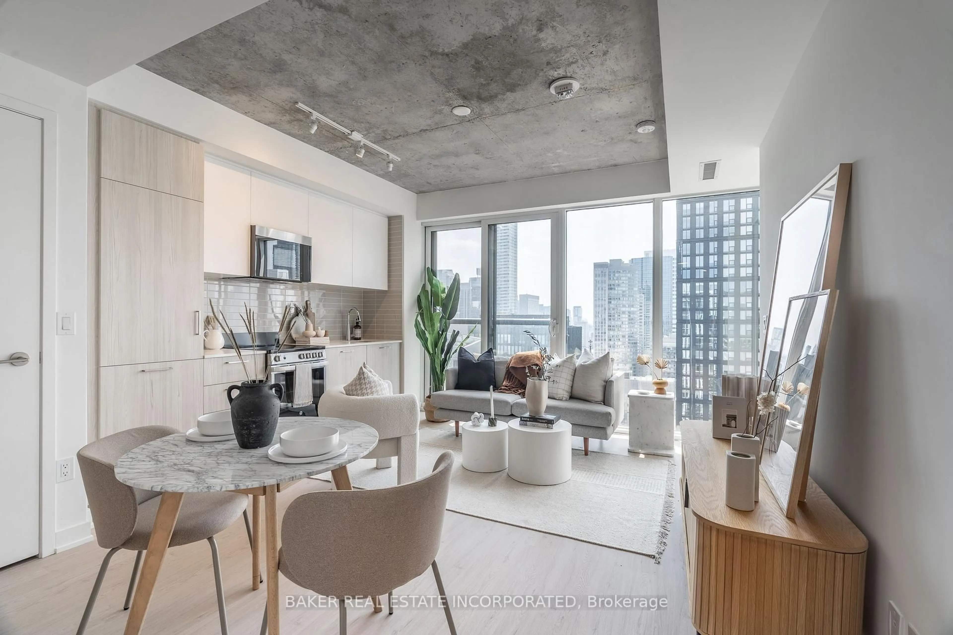 Living room with furniture, cement floor for 65 Mutual St #2905, Toronto Ontario M5B 0E5