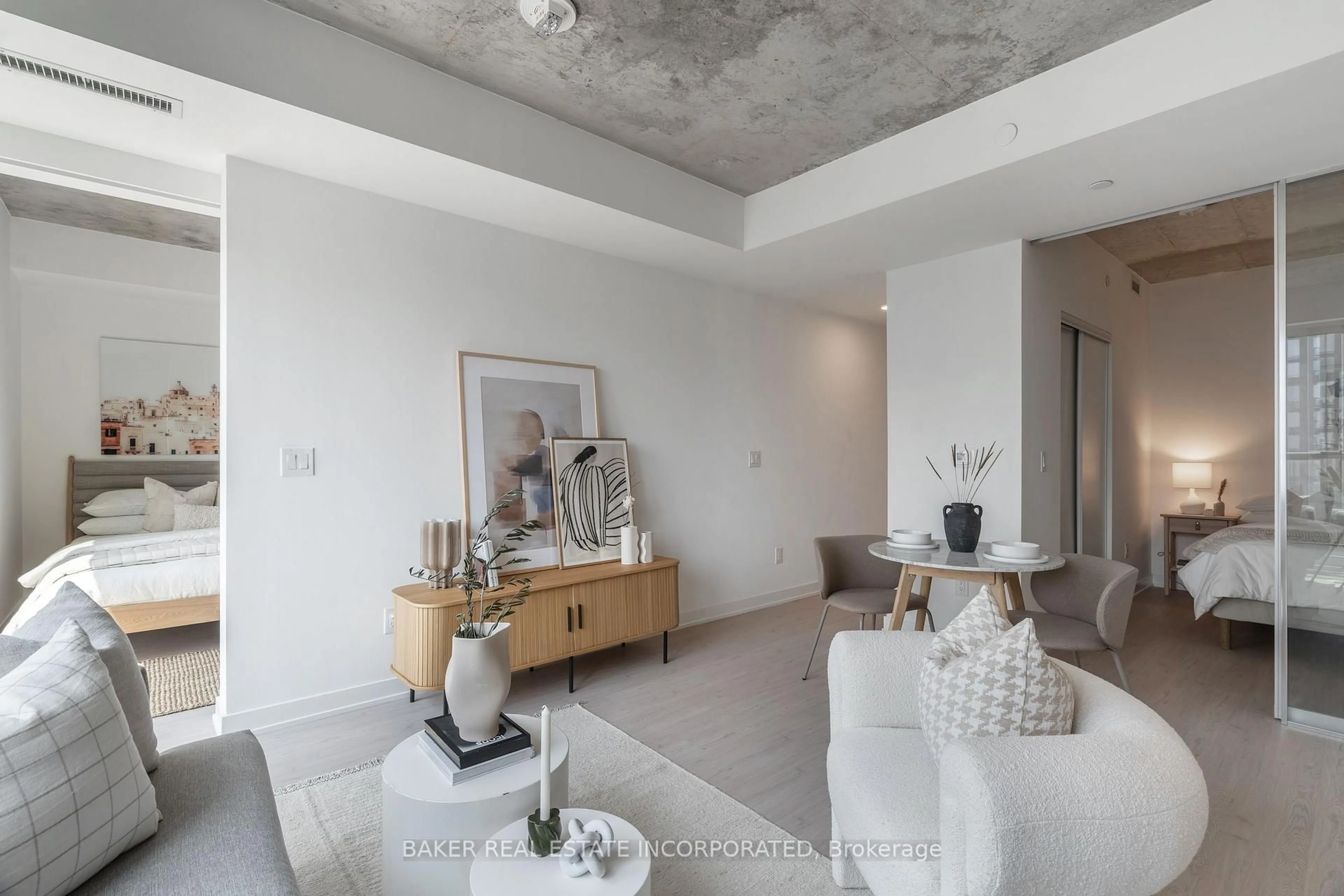 Living room with furniture, cement floor for 65 Mutual St #2905, Toronto Ontario M5B 0E5