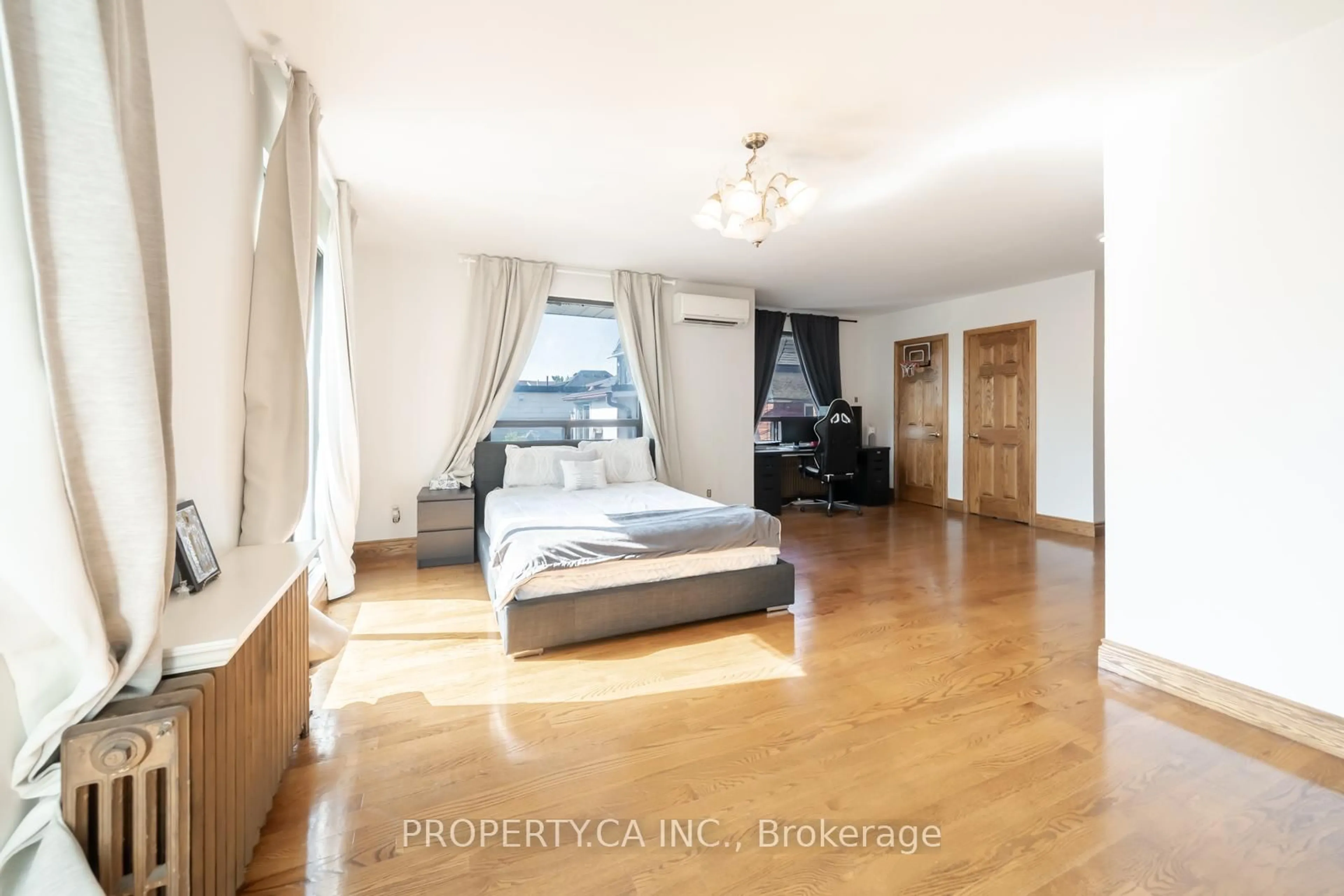 Bedroom with bed, wood/laminate floor for 35 Pinewood Ave, Toronto Ontario M6C 2V2