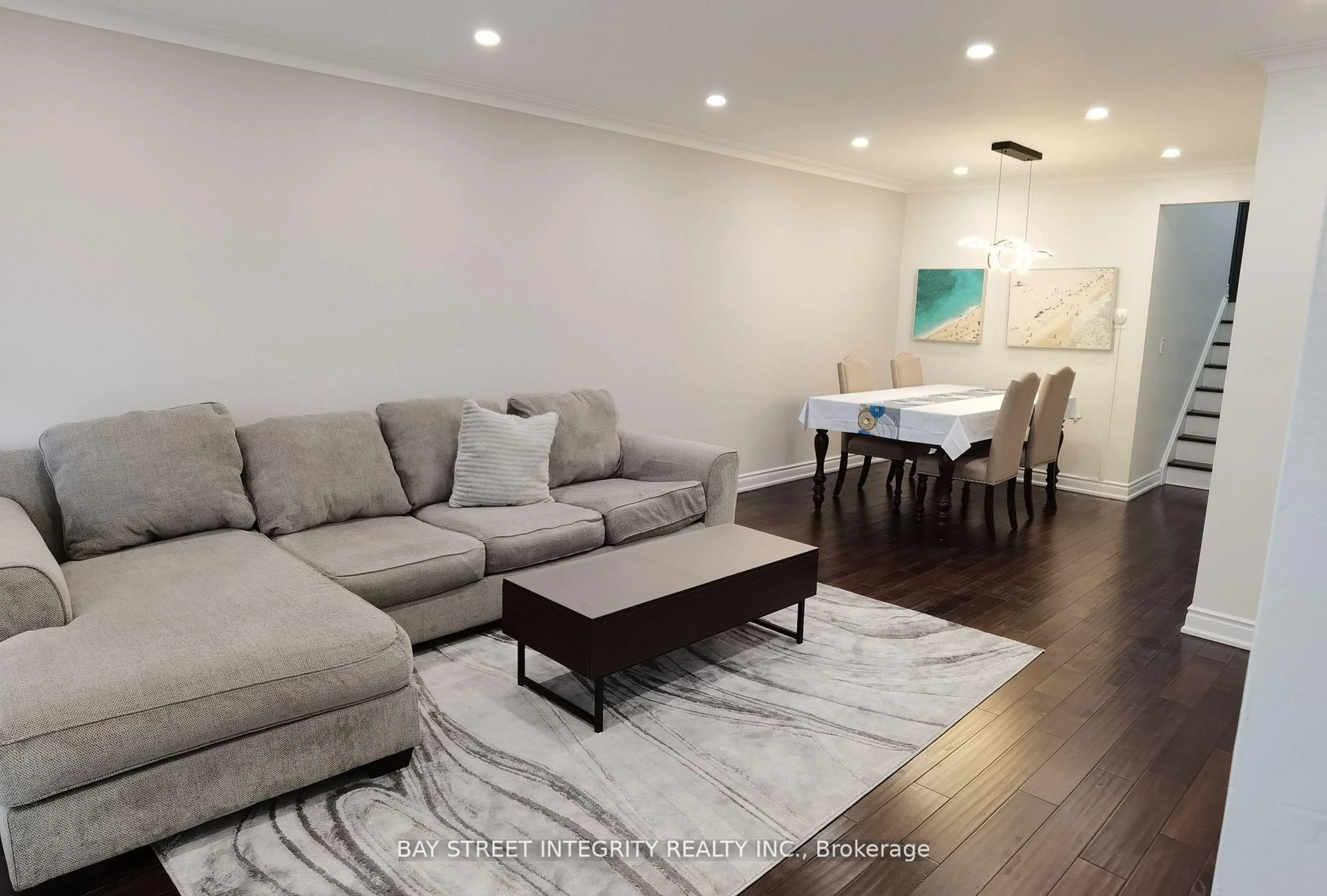 Living room with furniture, wood/laminate floor for 108 Bowhill Cres, Toronto Ontario M2J 3S2