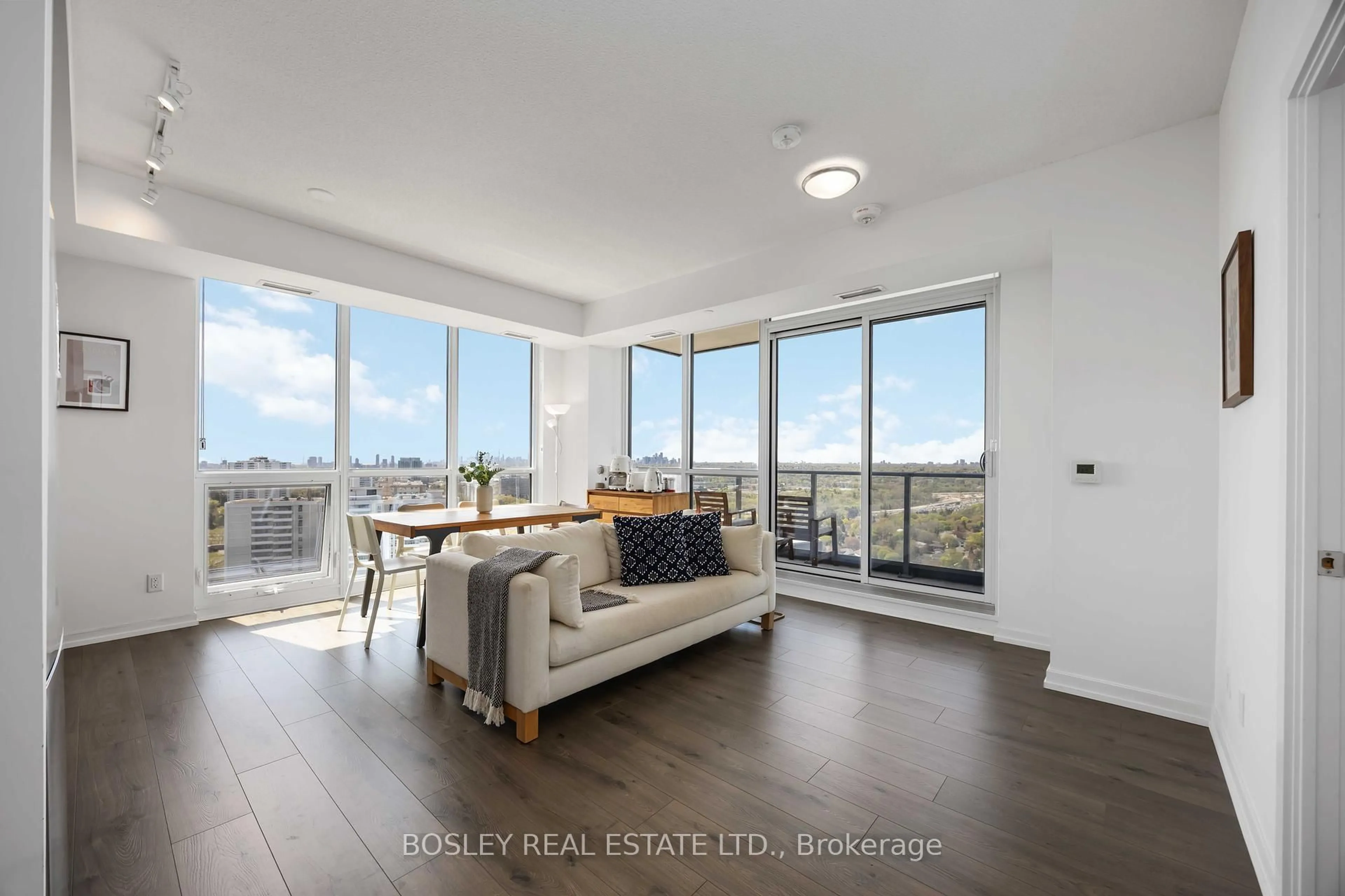Living room with furniture, wood/laminate floor for 38 Forest Manor Rd #1807, Toronto Ontario M2J 0H4