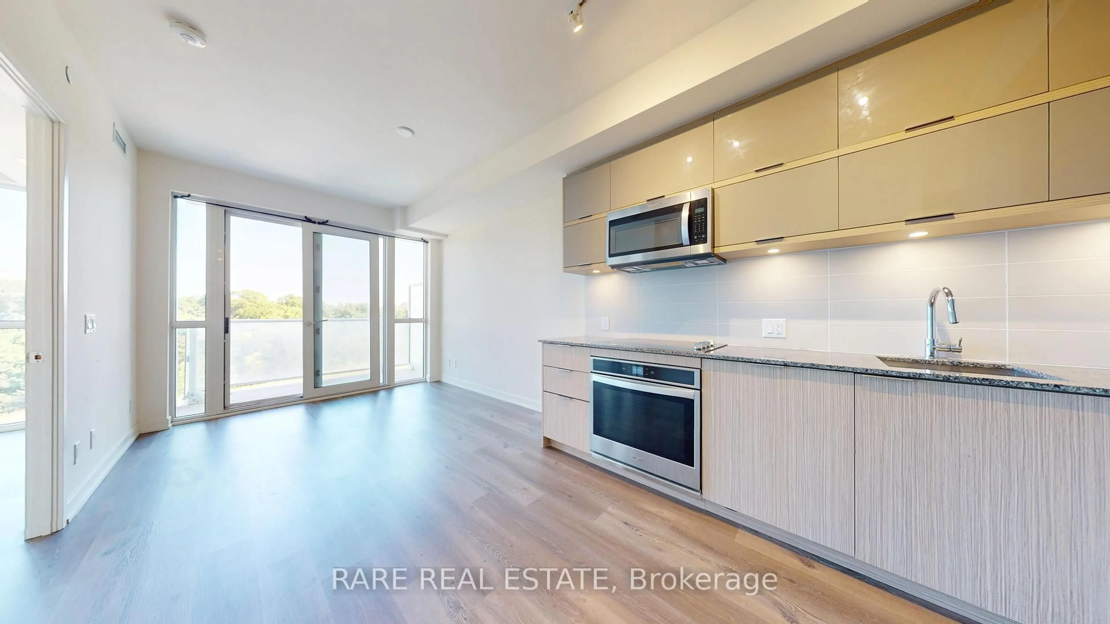 Open concept kitchen, wood/laminate floor for 10 Deerlick Crt #612, Toronto Ontario M3A 0A7