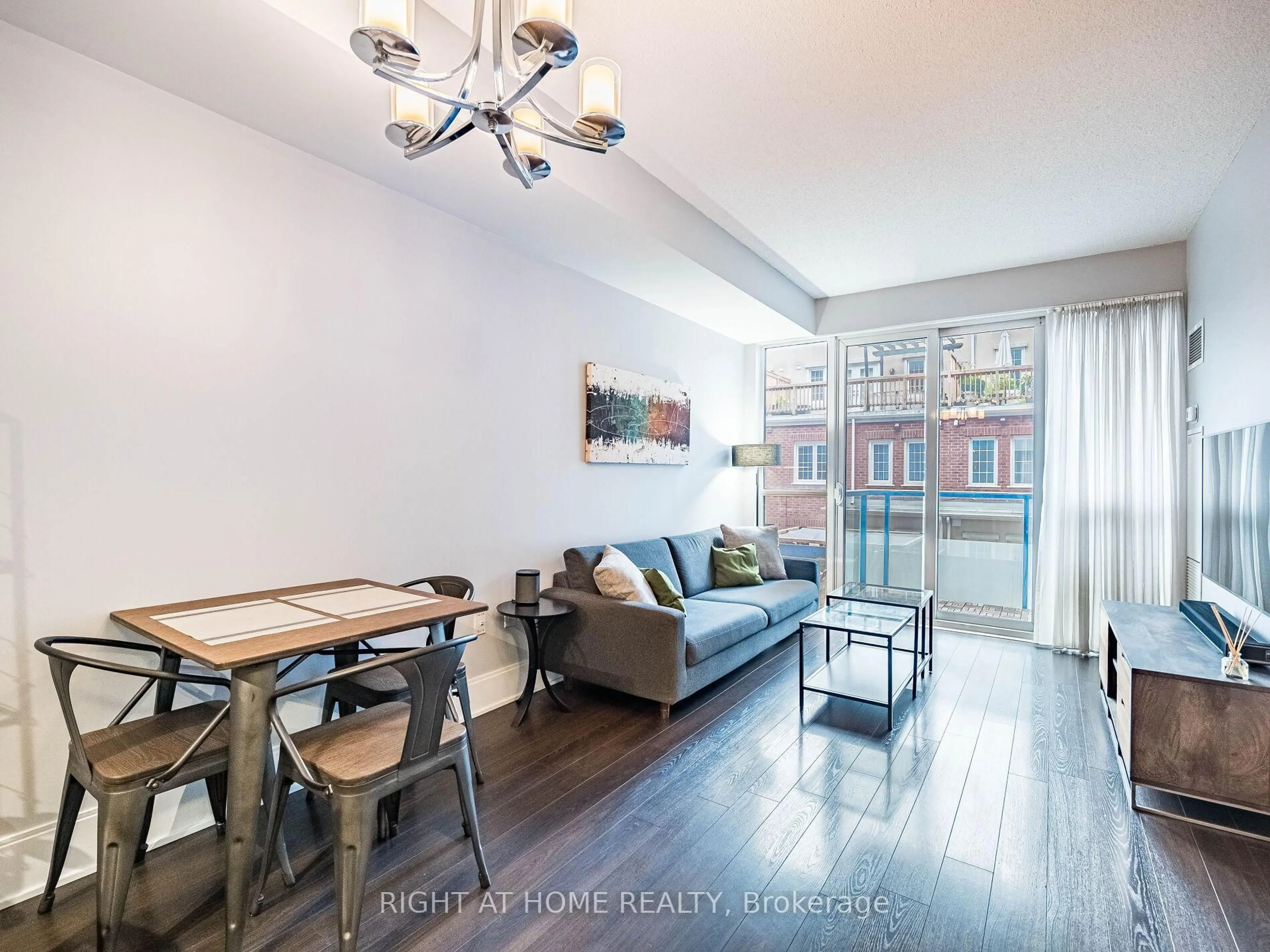 Living room with furniture, wood/laminate floor for 560 Front St #221, Toronto Ontario M5V 1C1
