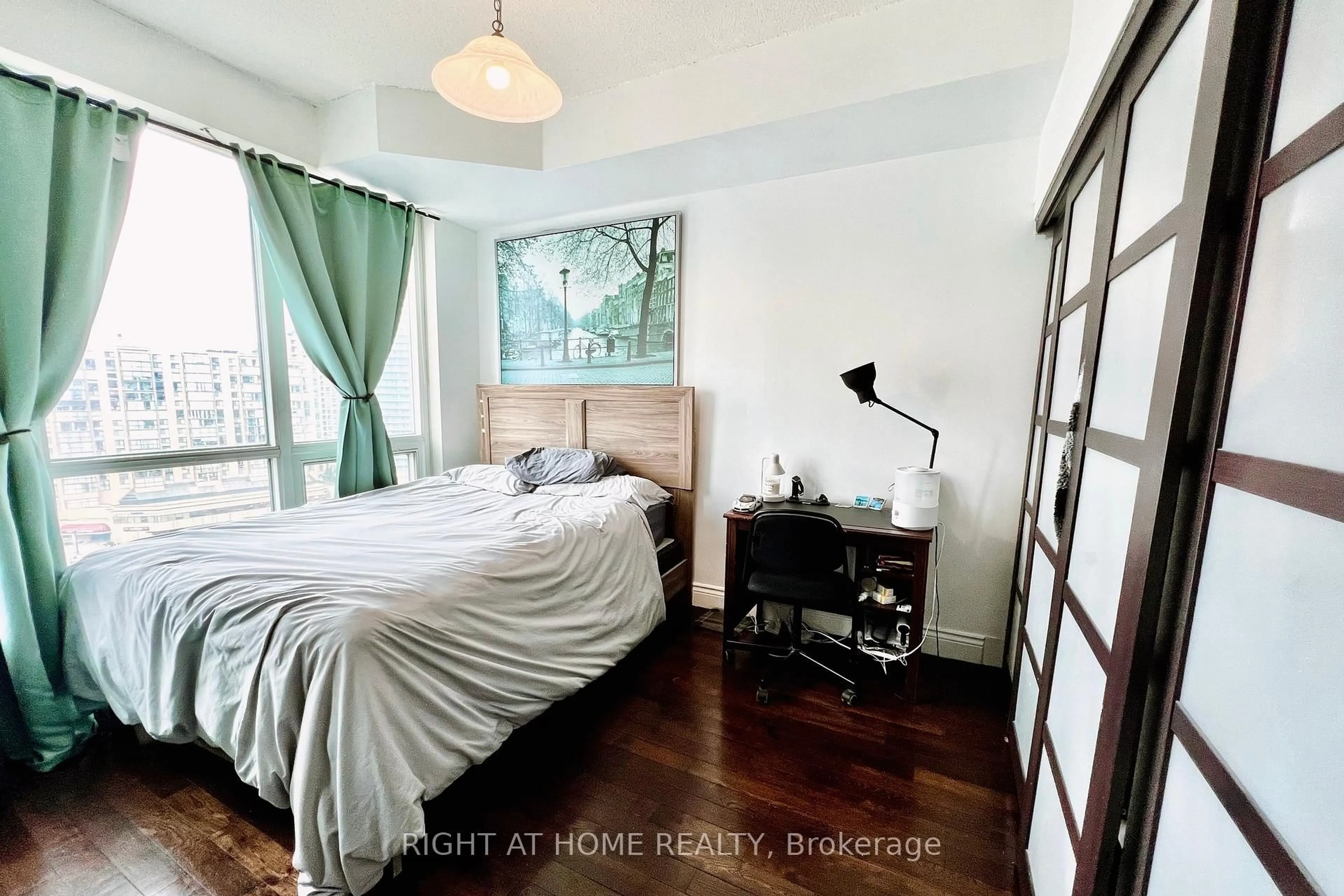 Bedroom with bed, wood/laminate floor for 60 Byng Ave #1315, Toronto Ontario M2N 7K3