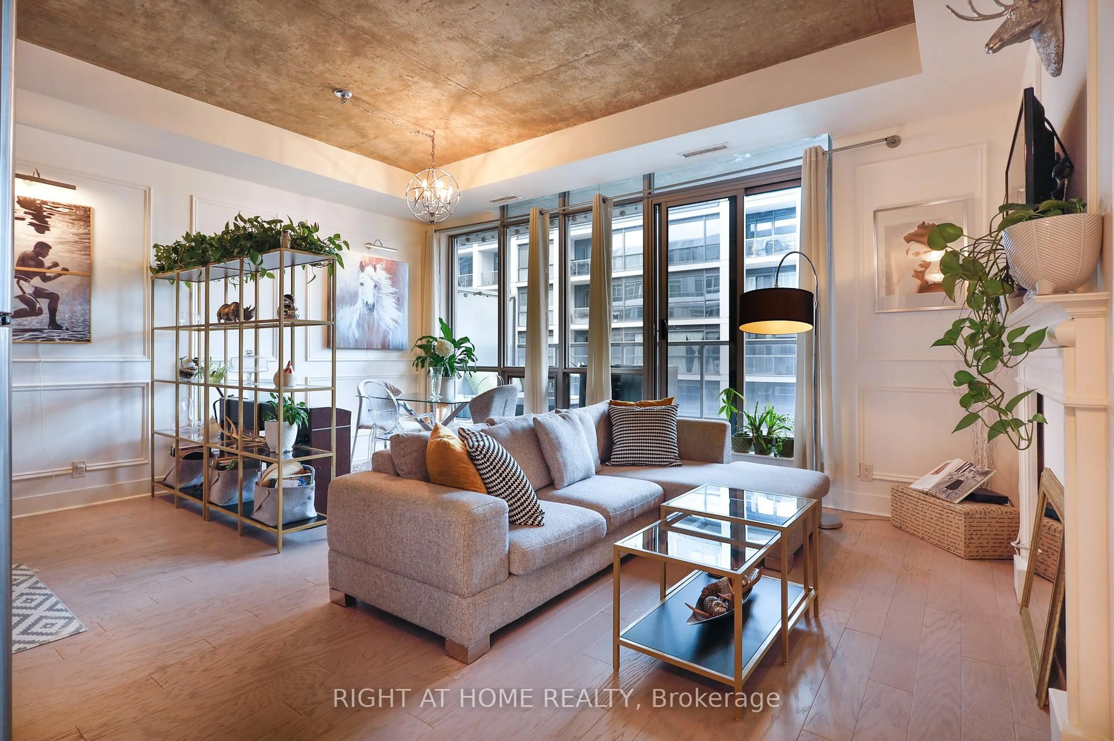 Living room with furniture, cement floor for 399 Adelaide St #703, Toronto Ontario M5V 1S1