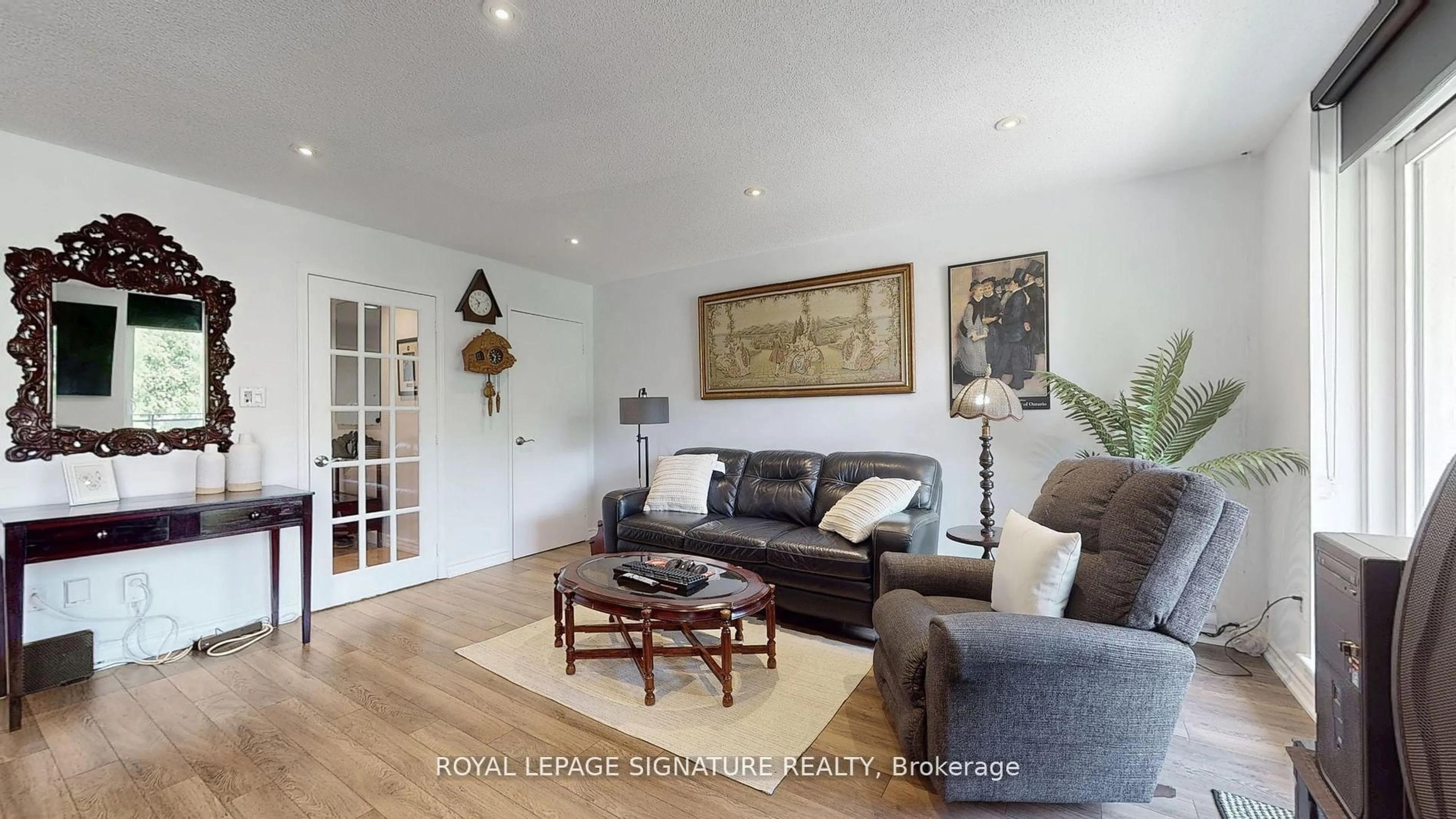 Living room with furniture, wood/laminate floor for 20 Moonstone Bywy #190, Toronto Ontario M2H 3J4