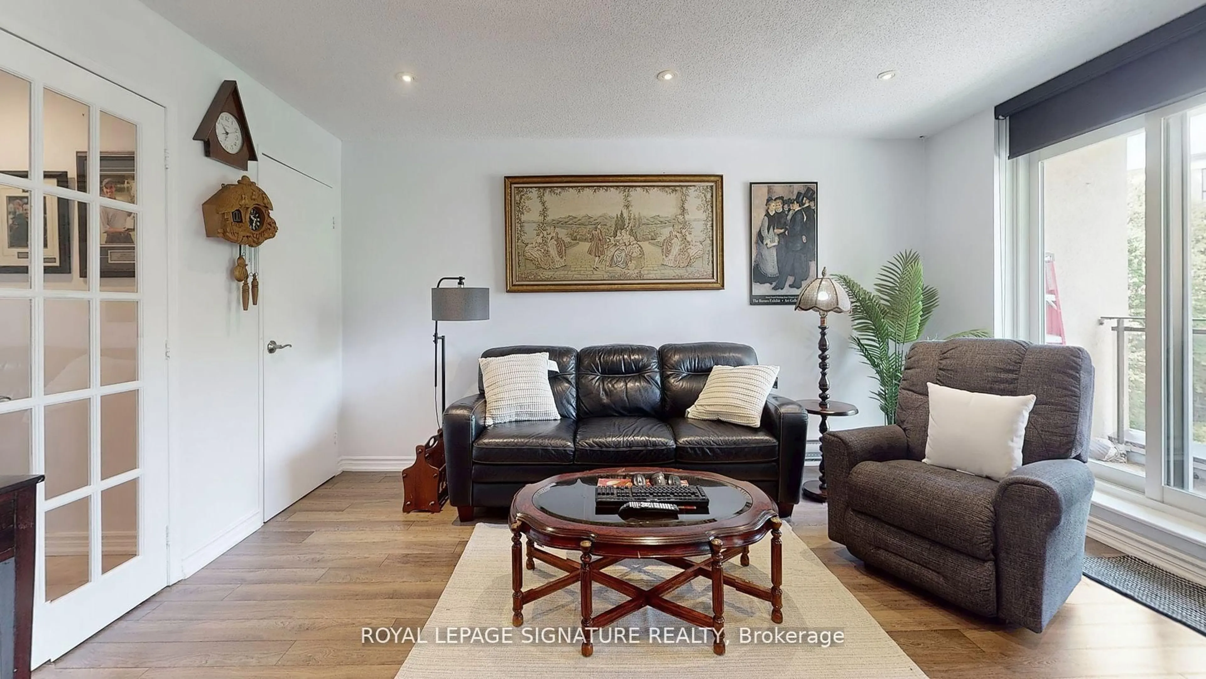 Living room with furniture, wood/laminate floor for 20 Moonstone Bywy #190, Toronto Ontario M2H 3J4