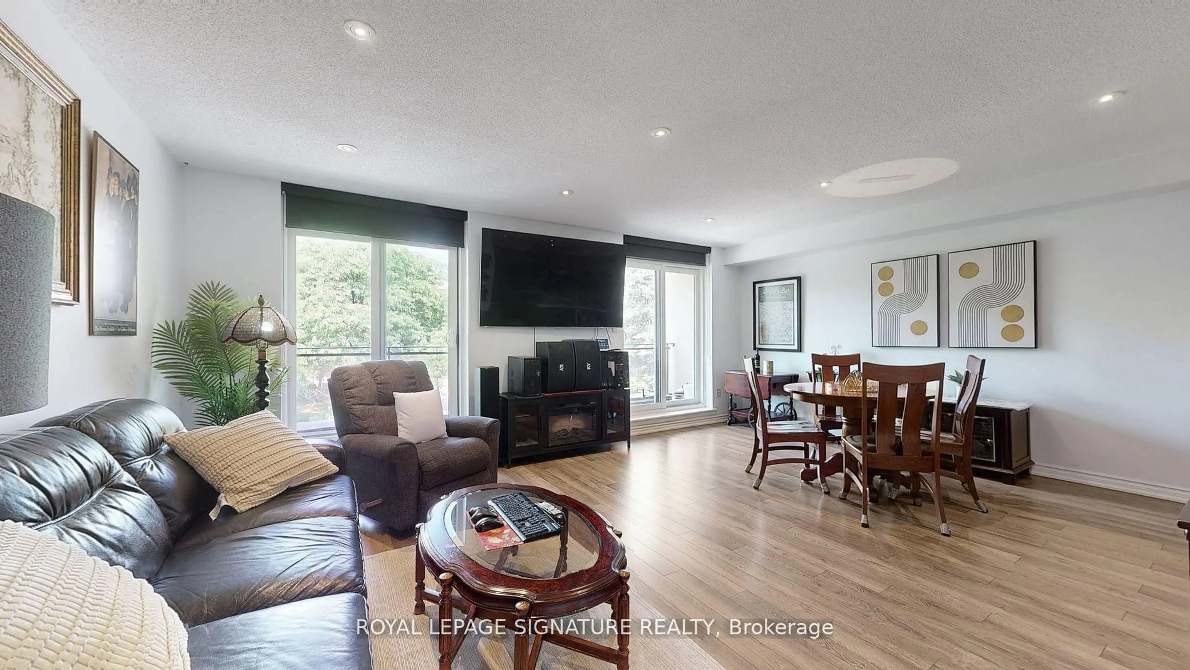 Living room with furniture, wood/laminate floor for 20 Moonstone Bywy #190, Toronto Ontario M2H 3J4