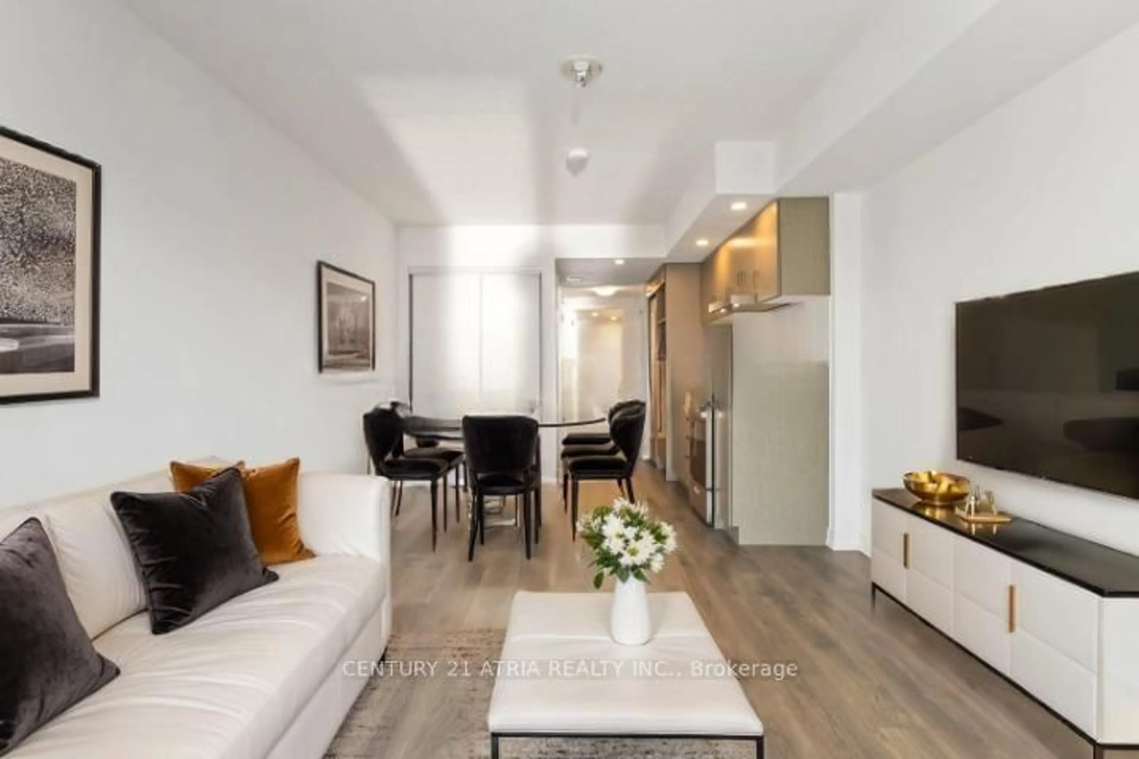 Living room with furniture, wood/laminate floor for 219 Dundas St #2310, Toronto Ontario M5A 0V1
