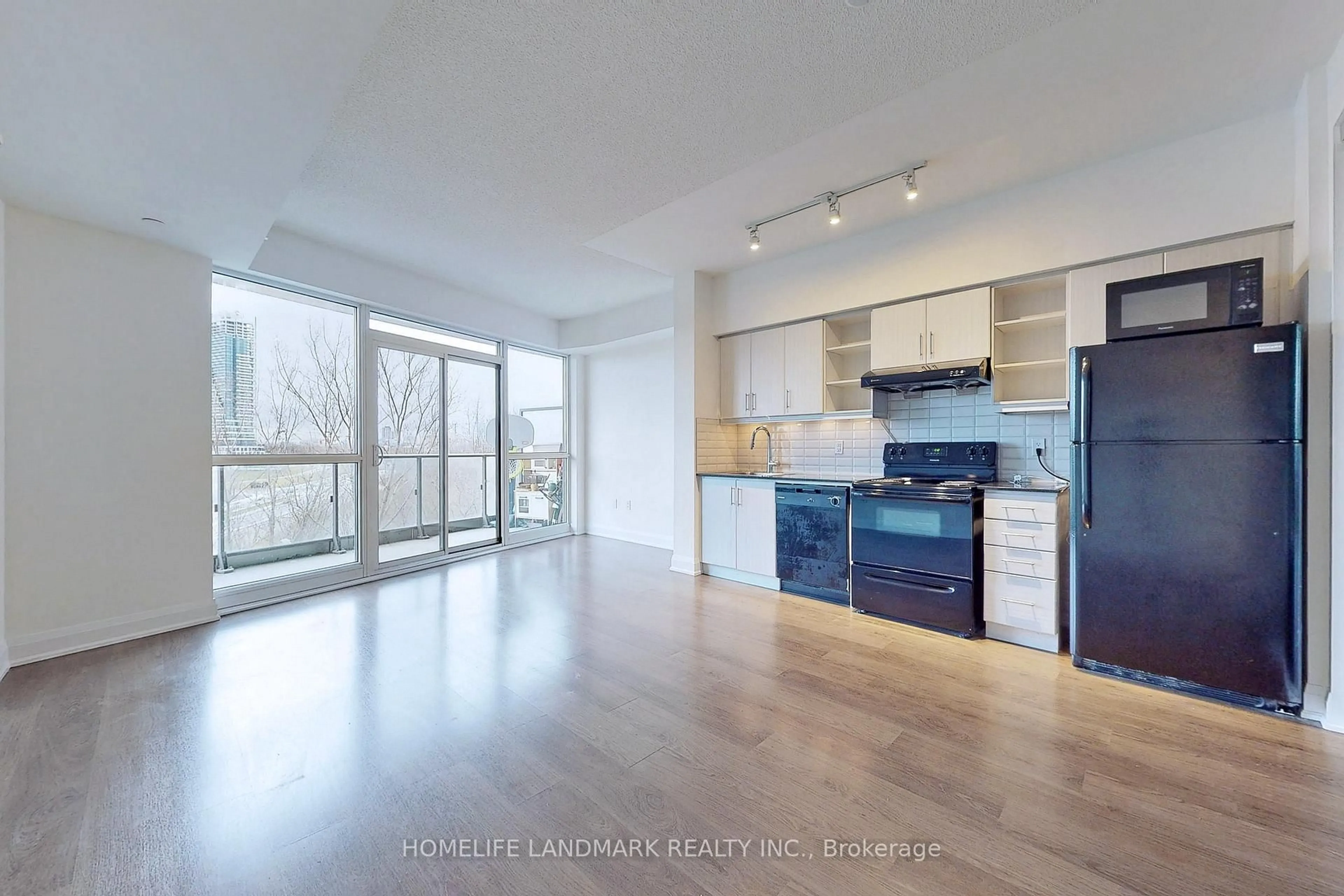 Open concept kitchen, wood/laminate floor for 160 Vanderhoof Ave #316, Toronto Ontario M4G 0B7