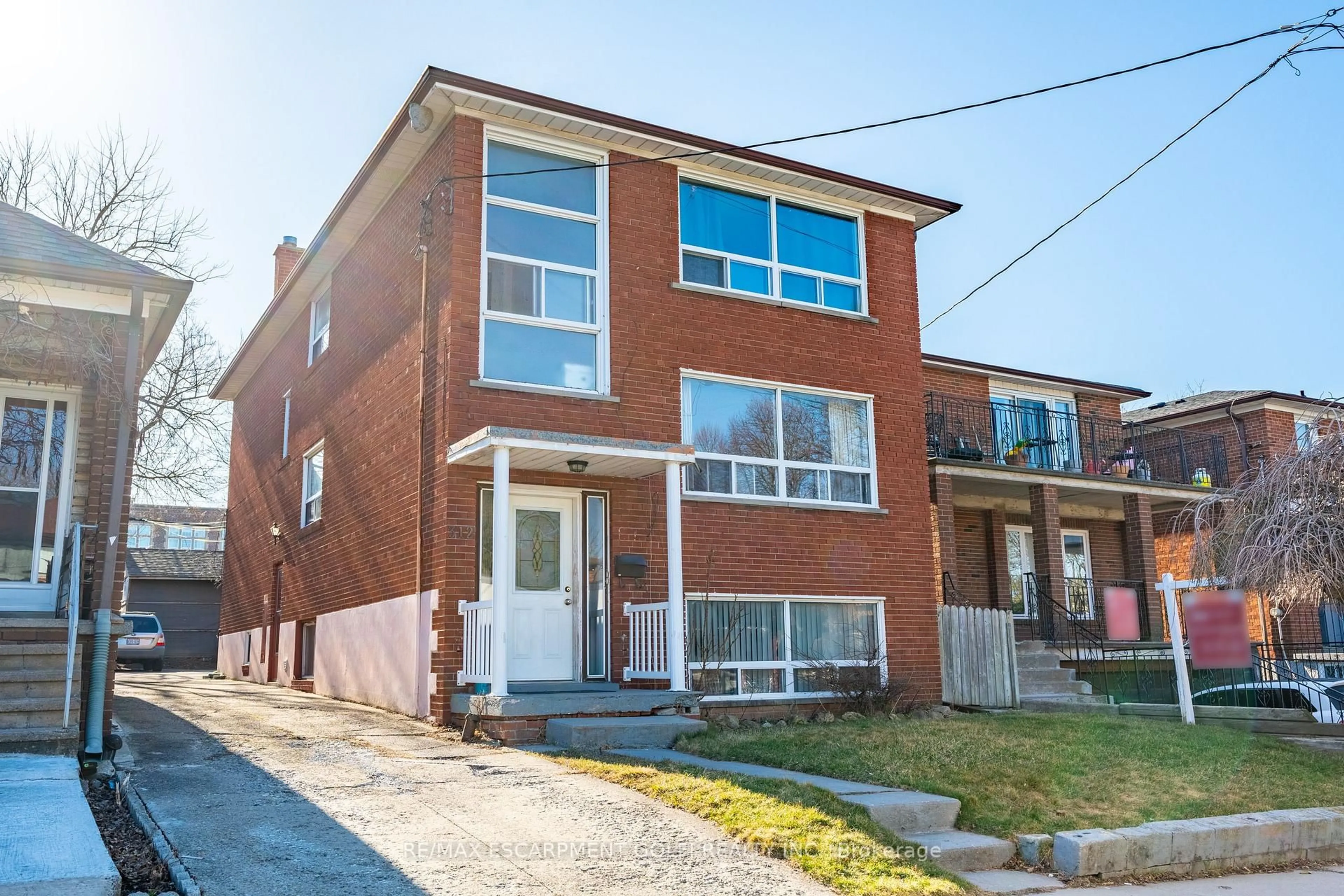 Home with brick exterior material, street for 312 ATLAS Ave, Toronto Ontario M6C 3P9