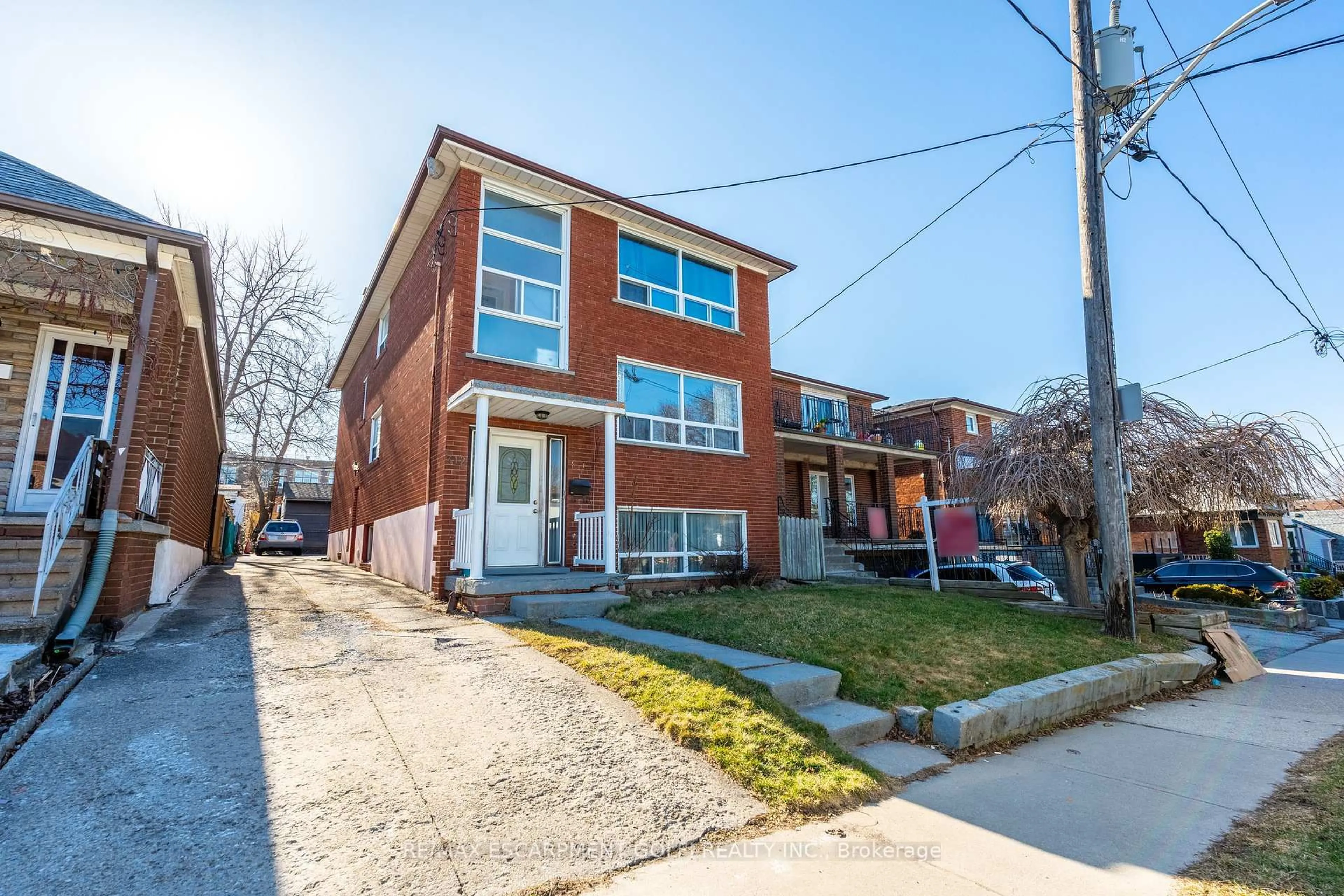 Home with brick exterior material, street for 312 ATLAS Ave, Toronto Ontario M6C 3P9