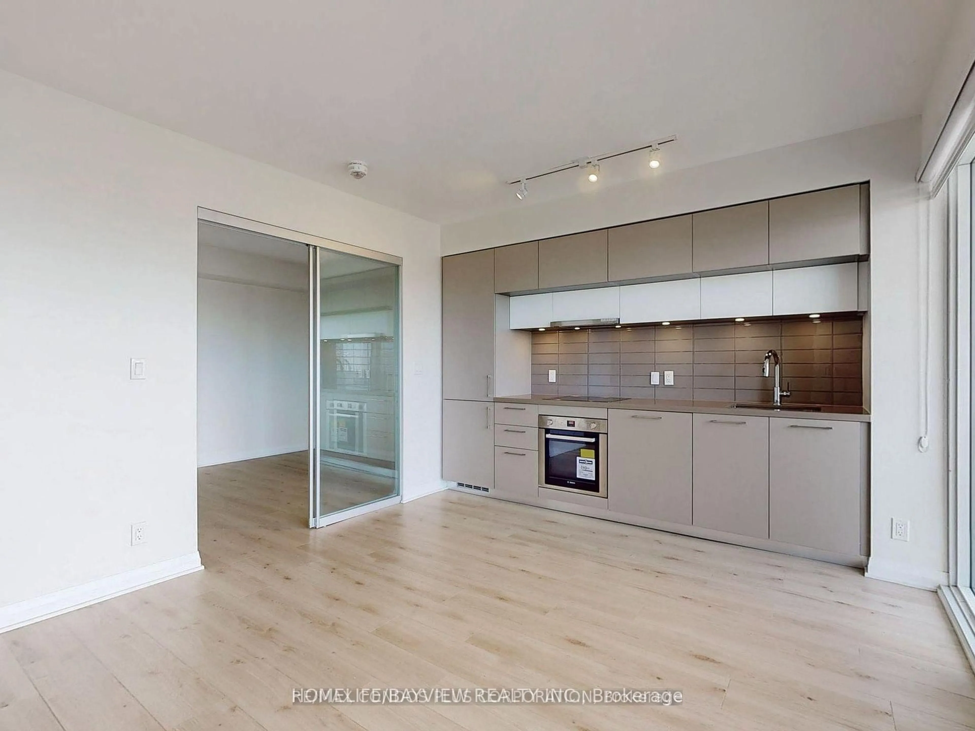 Open concept kitchen, wood/laminate floor for 99 Foxbar Rd #2305, Toronto Ontario M4V 0B2