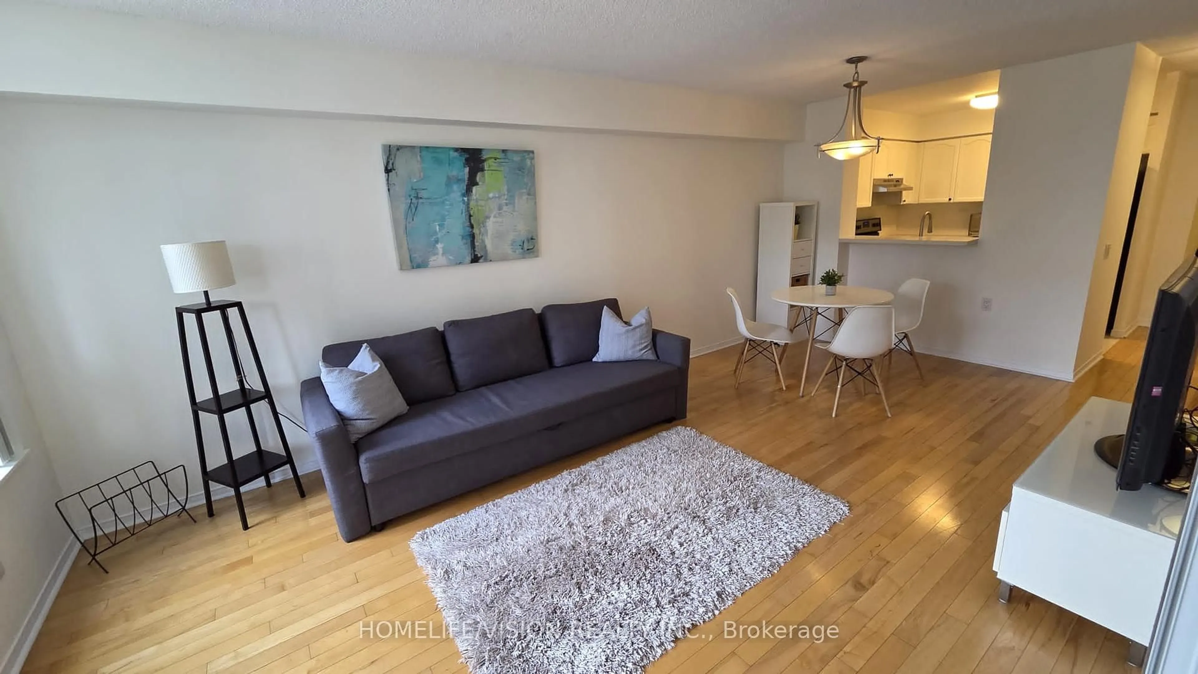 Living room with furniture, wood/laminate floor for 35 Finch Ave #703, Toronto Ontario M2N 6Z8