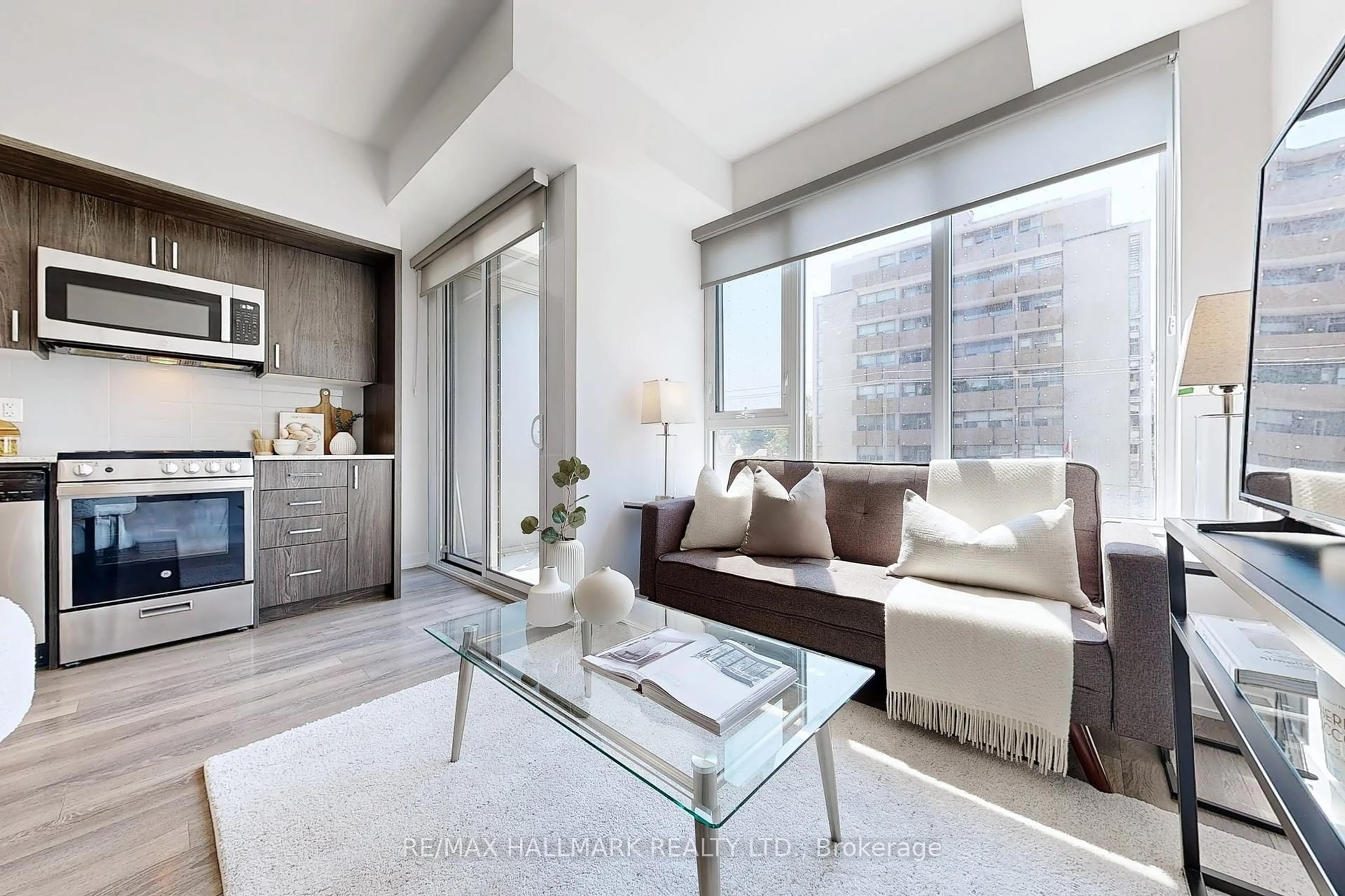 Living room with furniture, unknown for 1 Cardiff Rd #303, Toronto Ontario M4P 0G2