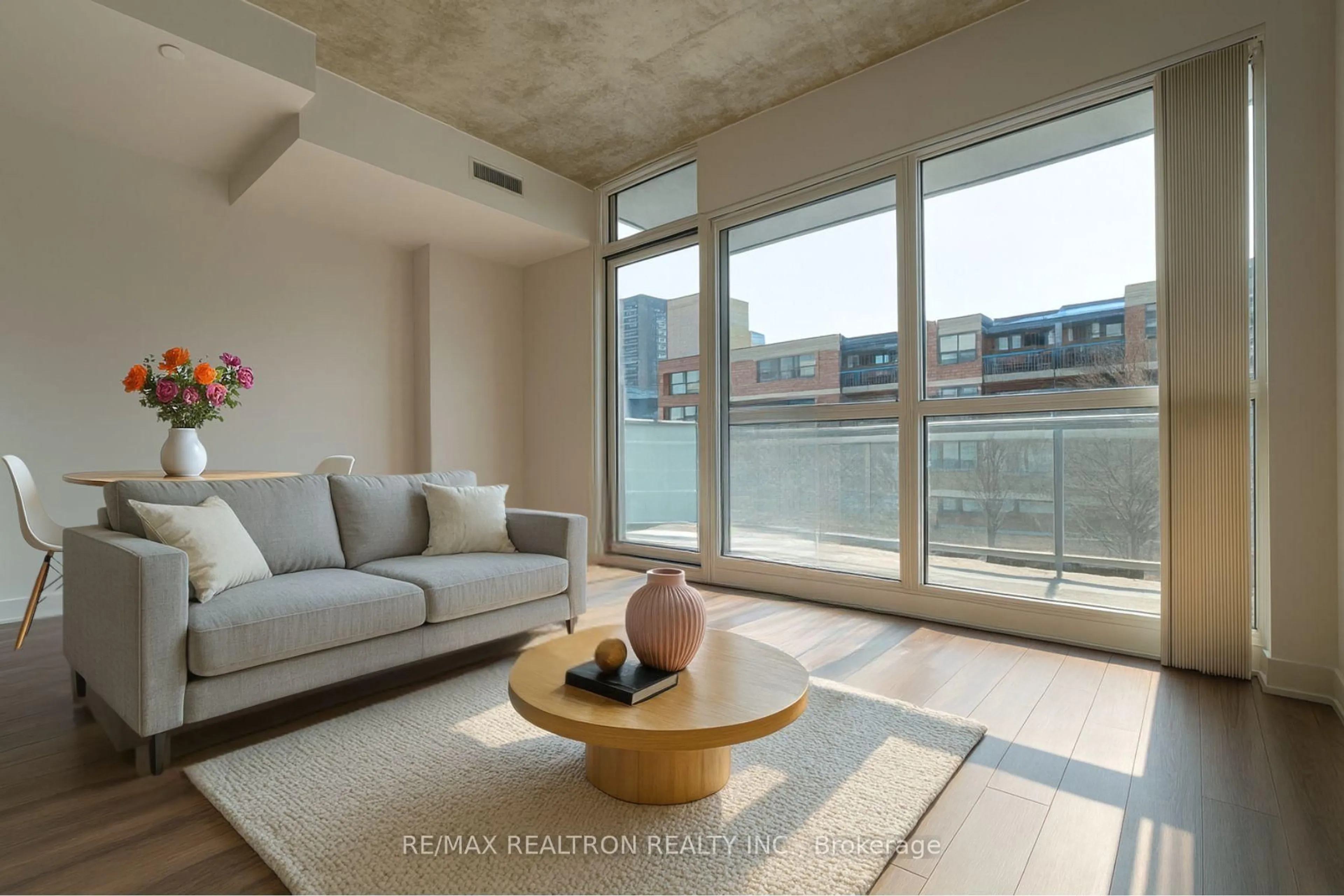 Living room with furniture, cement floor for 210 Simcoe St #704, Toronto Ontario M5T 1T4