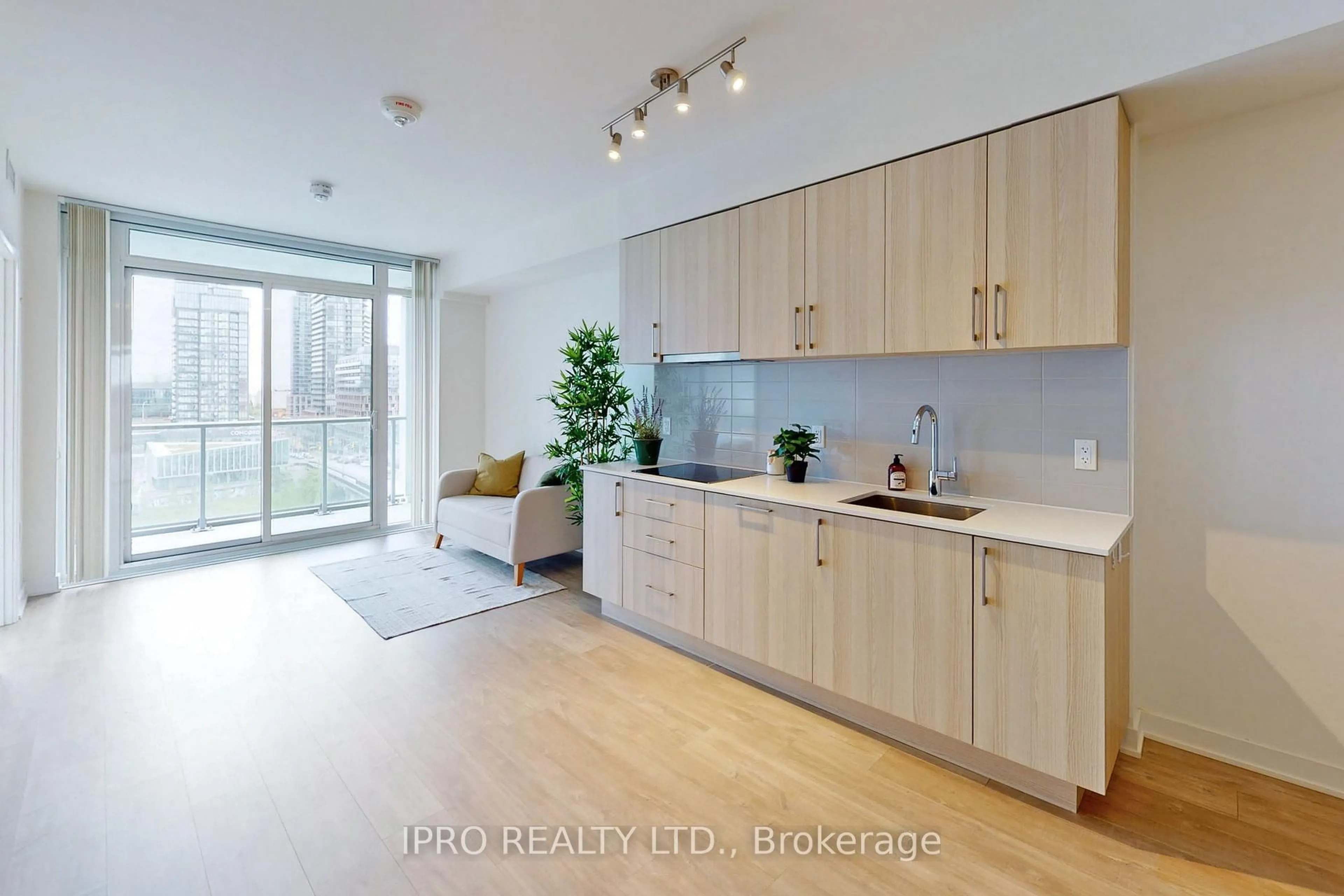 Open concept kitchen, wood/laminate floor for 27 Bathurst St #703W, Toronto Ontario M5V 2P1