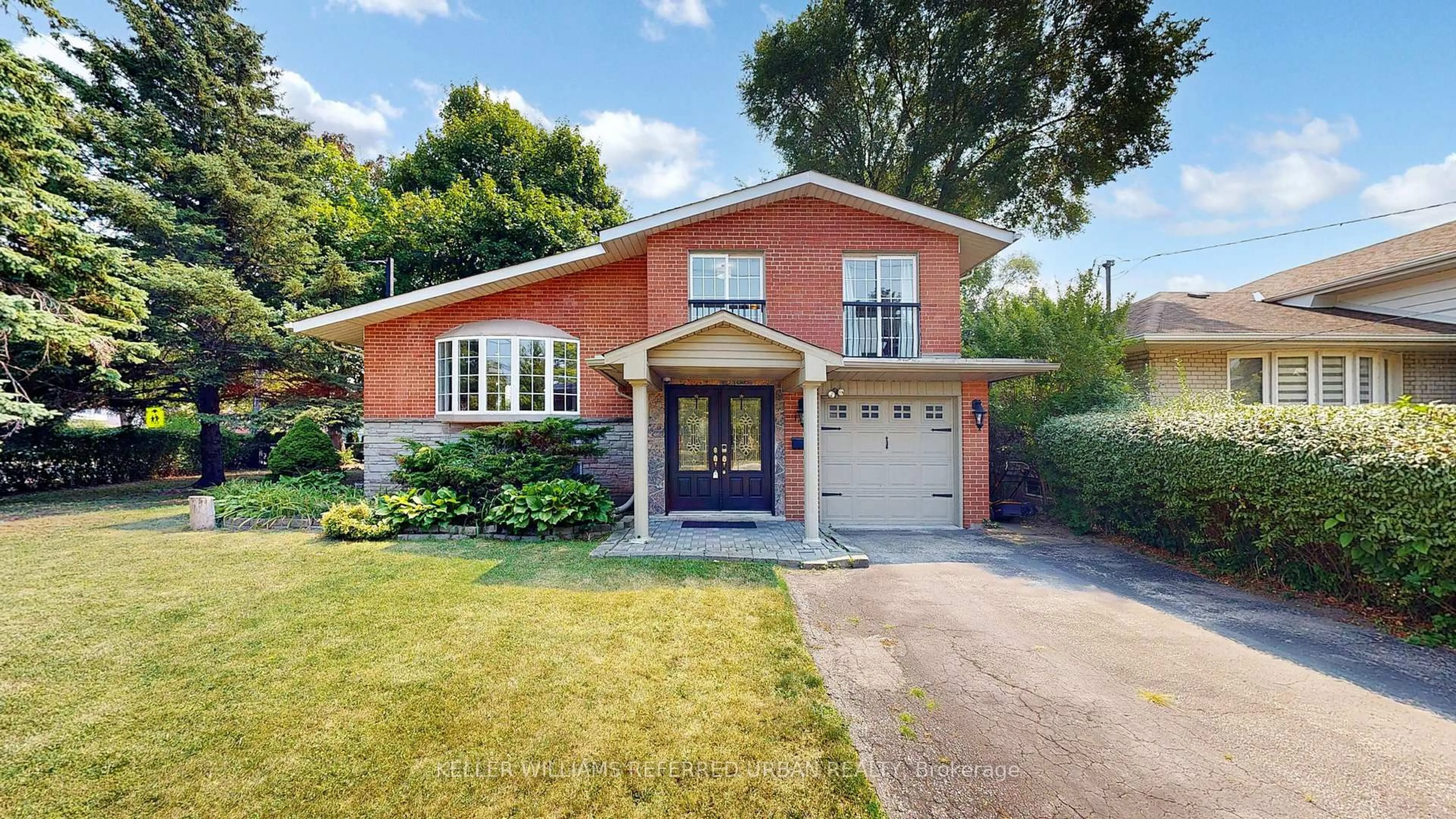 Home with brick exterior material, street for 129 Wyndcliff Cres, Toronto Ontario M4A 2J9