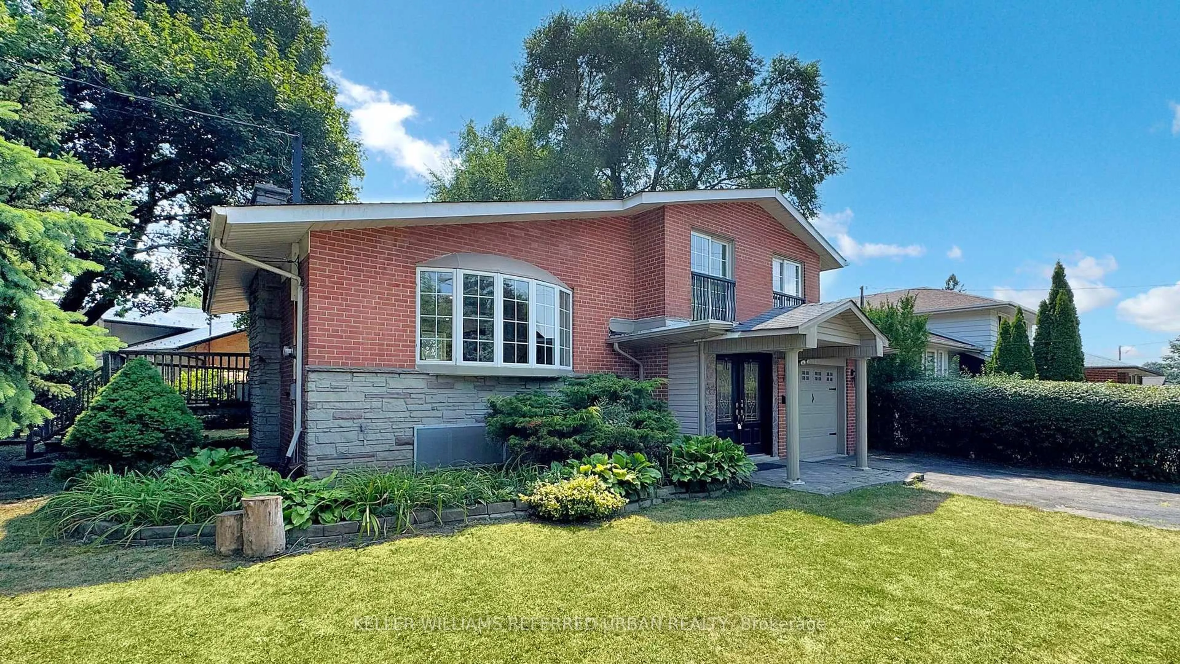 Home with brick exterior material, street for 129 Wyndcliff Cres, Toronto Ontario M4A 2J9