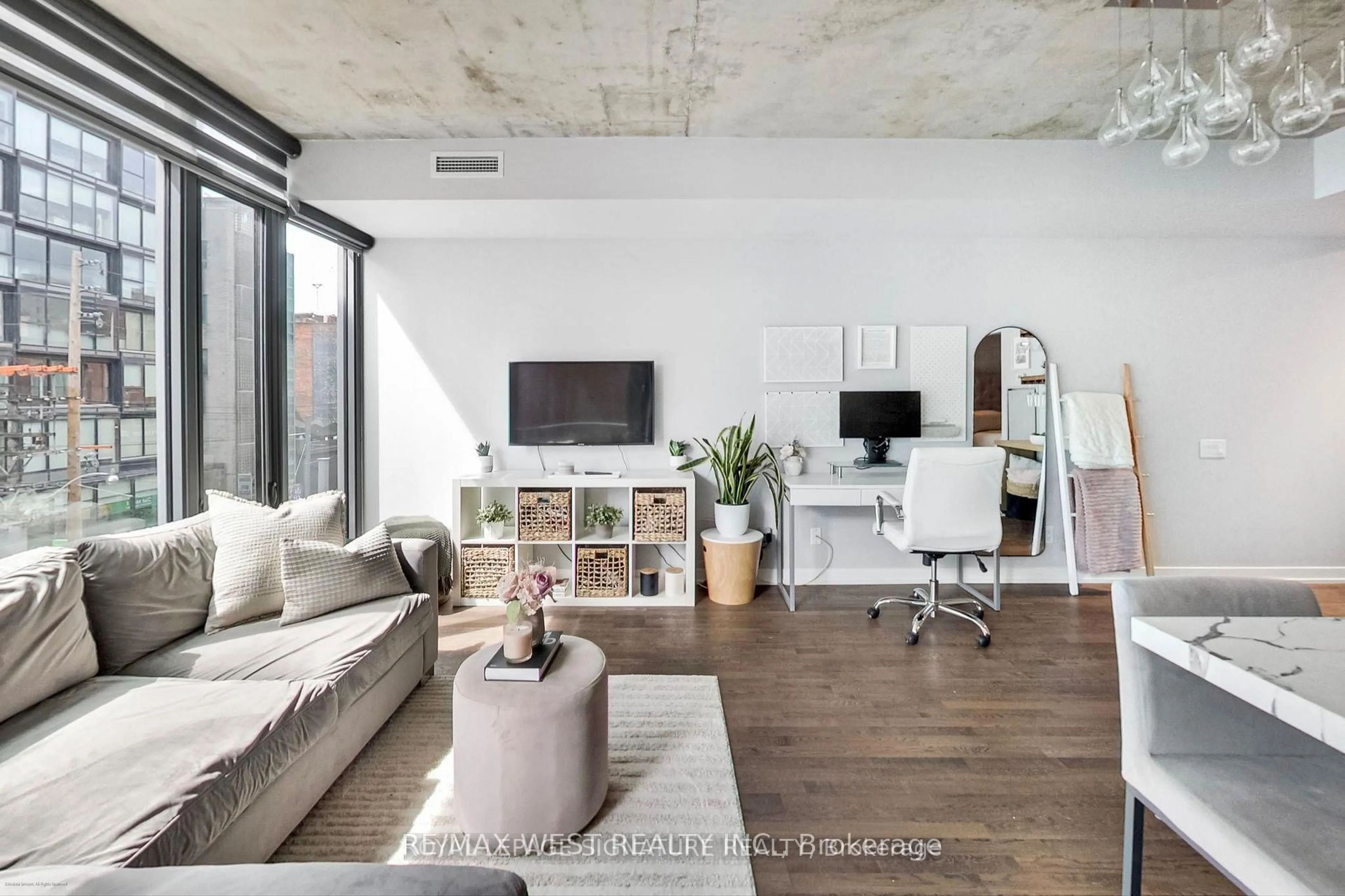 Living room with furniture, cement floor for 650 King St #310, Toronto Ontario M5V 0H6