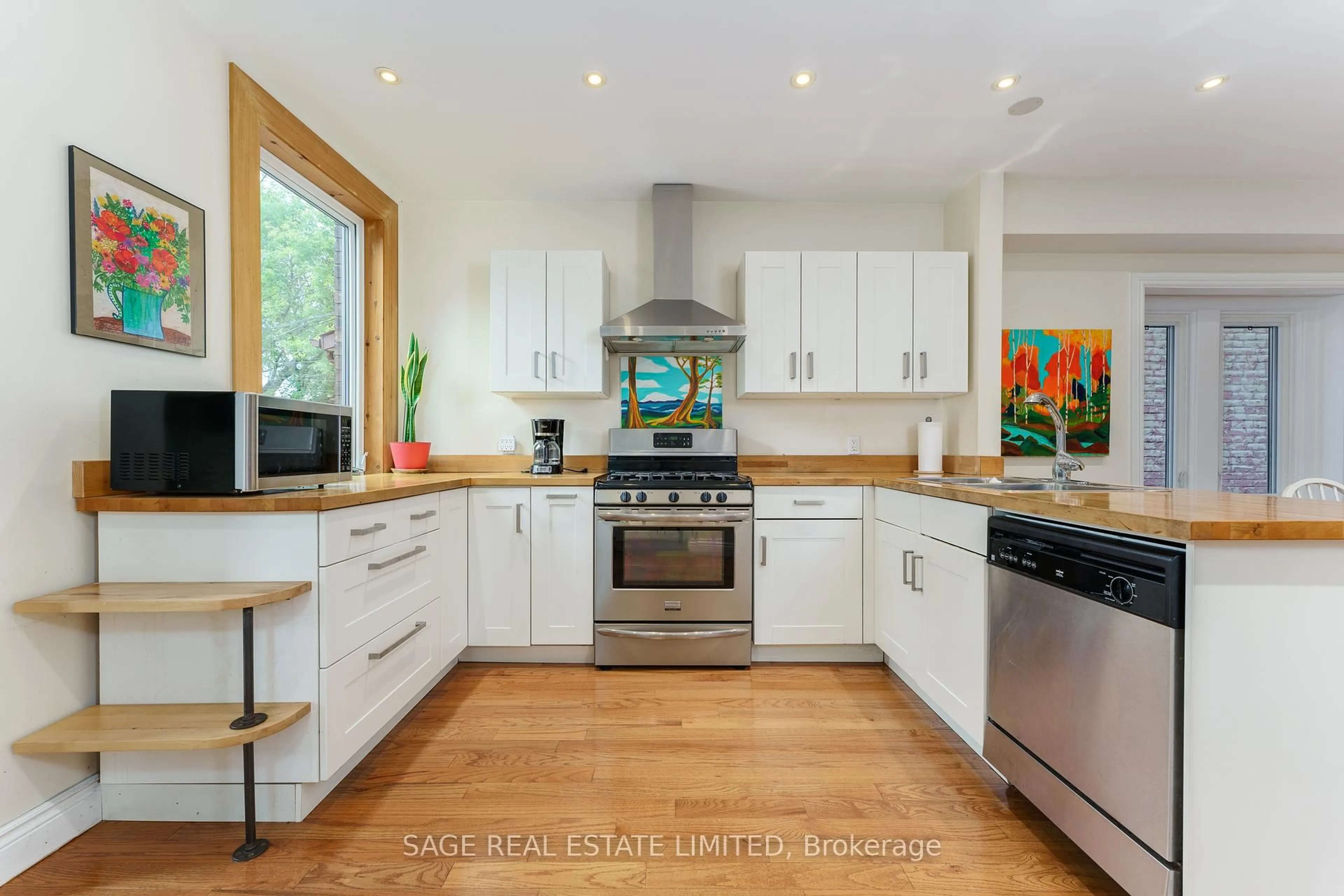 Open concept kitchen, wood/laminate floor for 17 Wyndham St, Toronto Ontario M6K 1R8