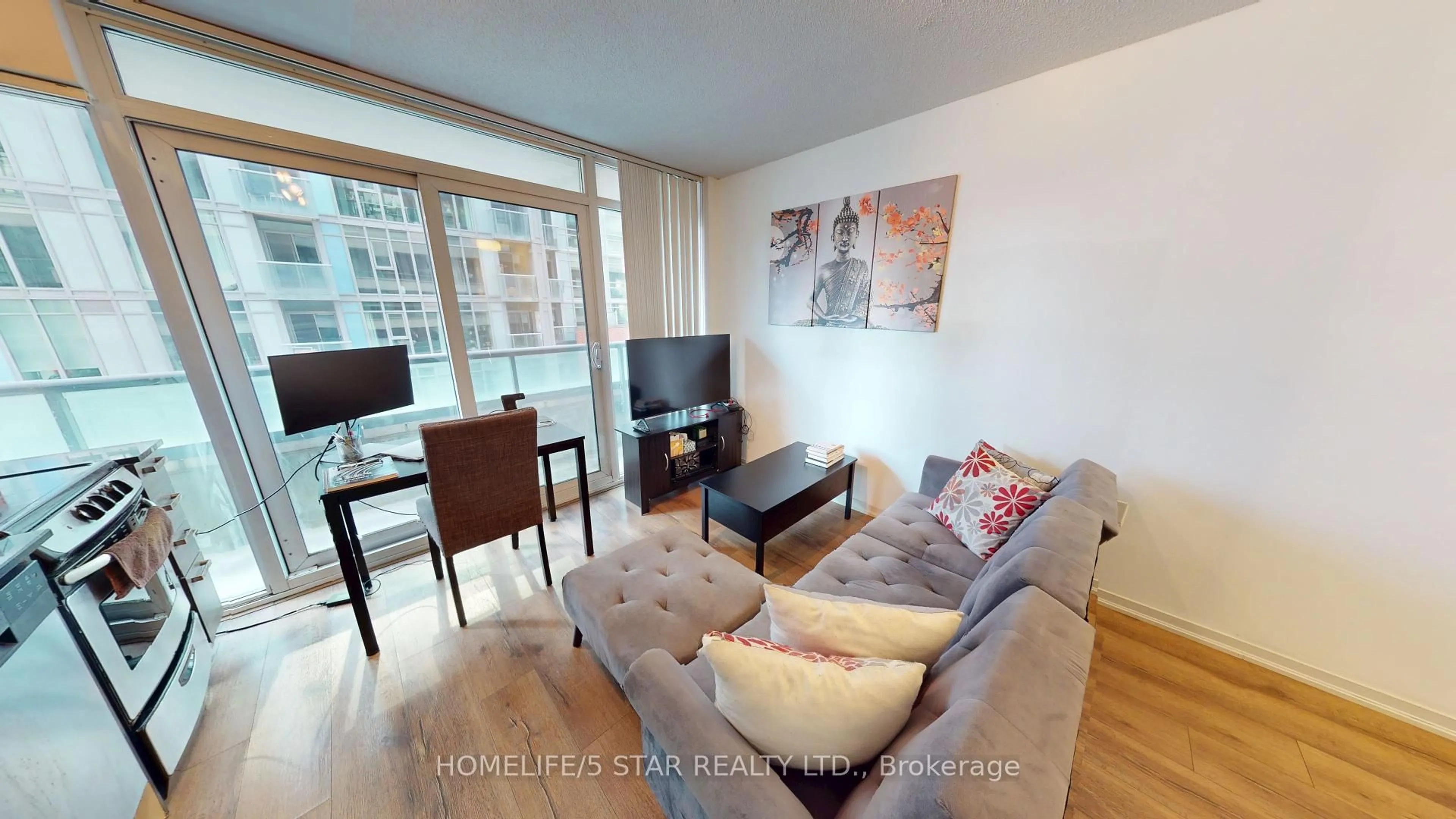 Living room with furniture, wood/laminate floor for 36 LISGAR St #726W, Toronto Ontario M6J 0C7