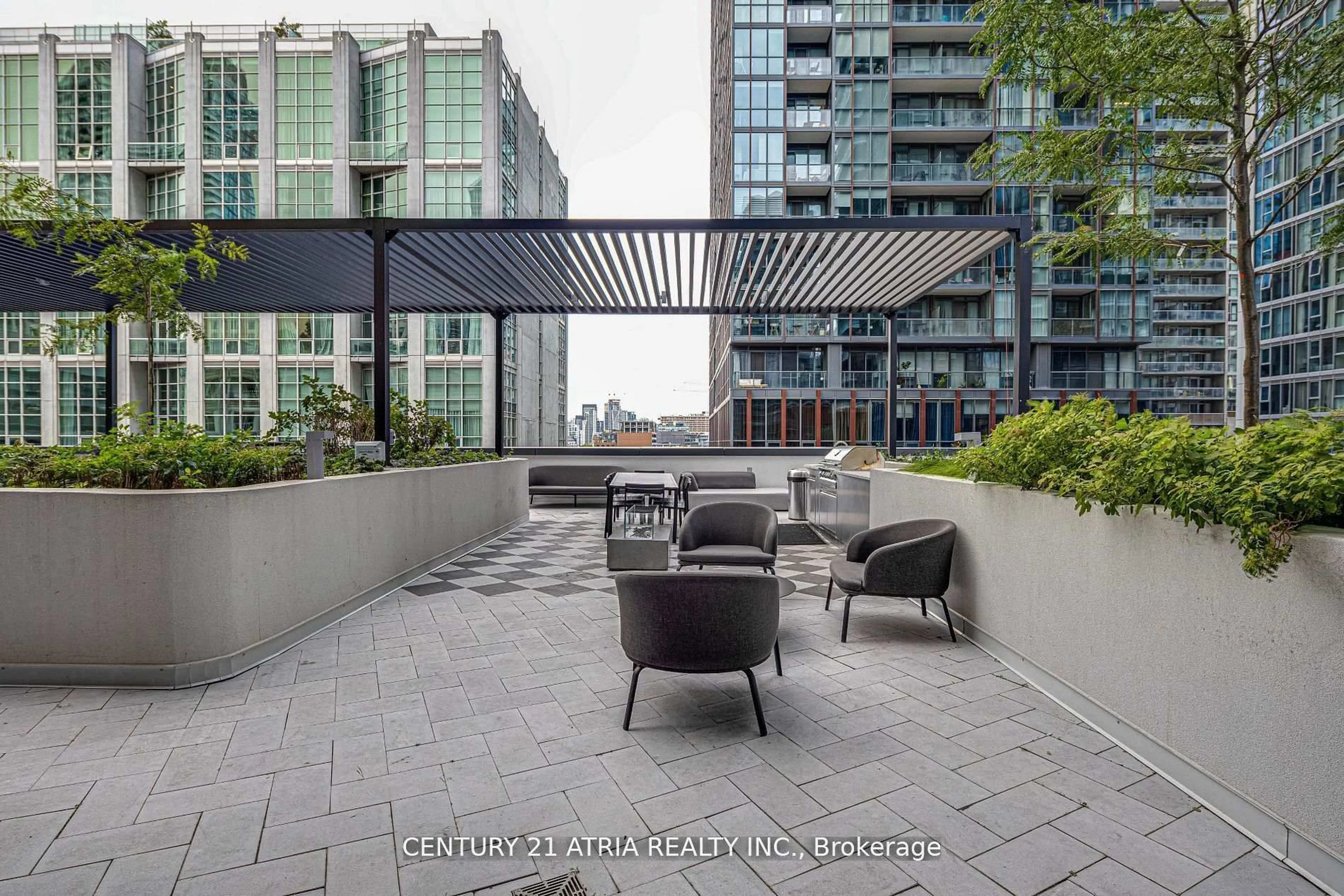 Patio, city buildings view from balcony for 55 Mercer St #322, Toronto Ontario M5V 0W4