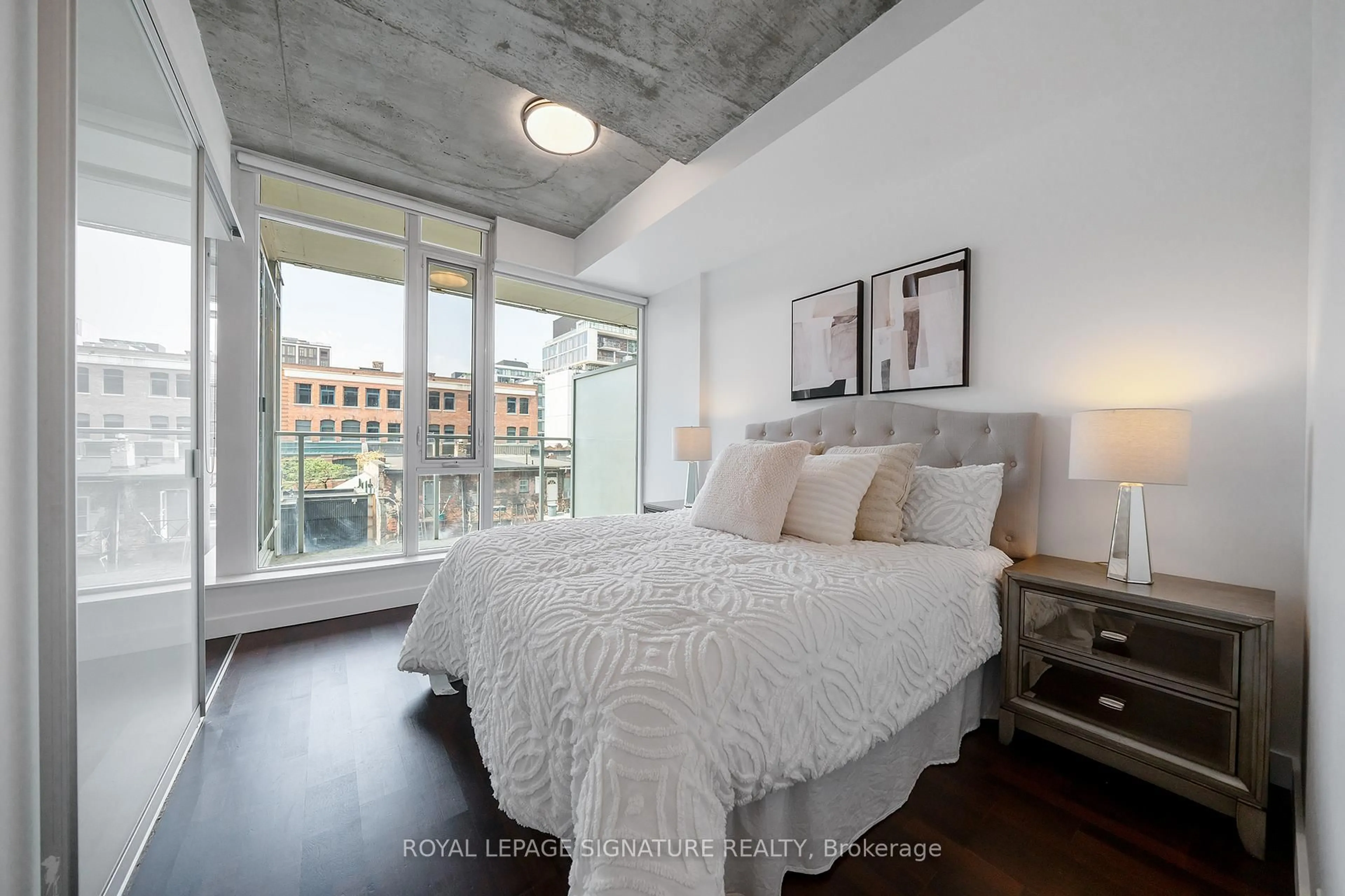 Bedroom with bed, cement floor for 75 Portland St #510, Toronto Ontario M5V 2M9