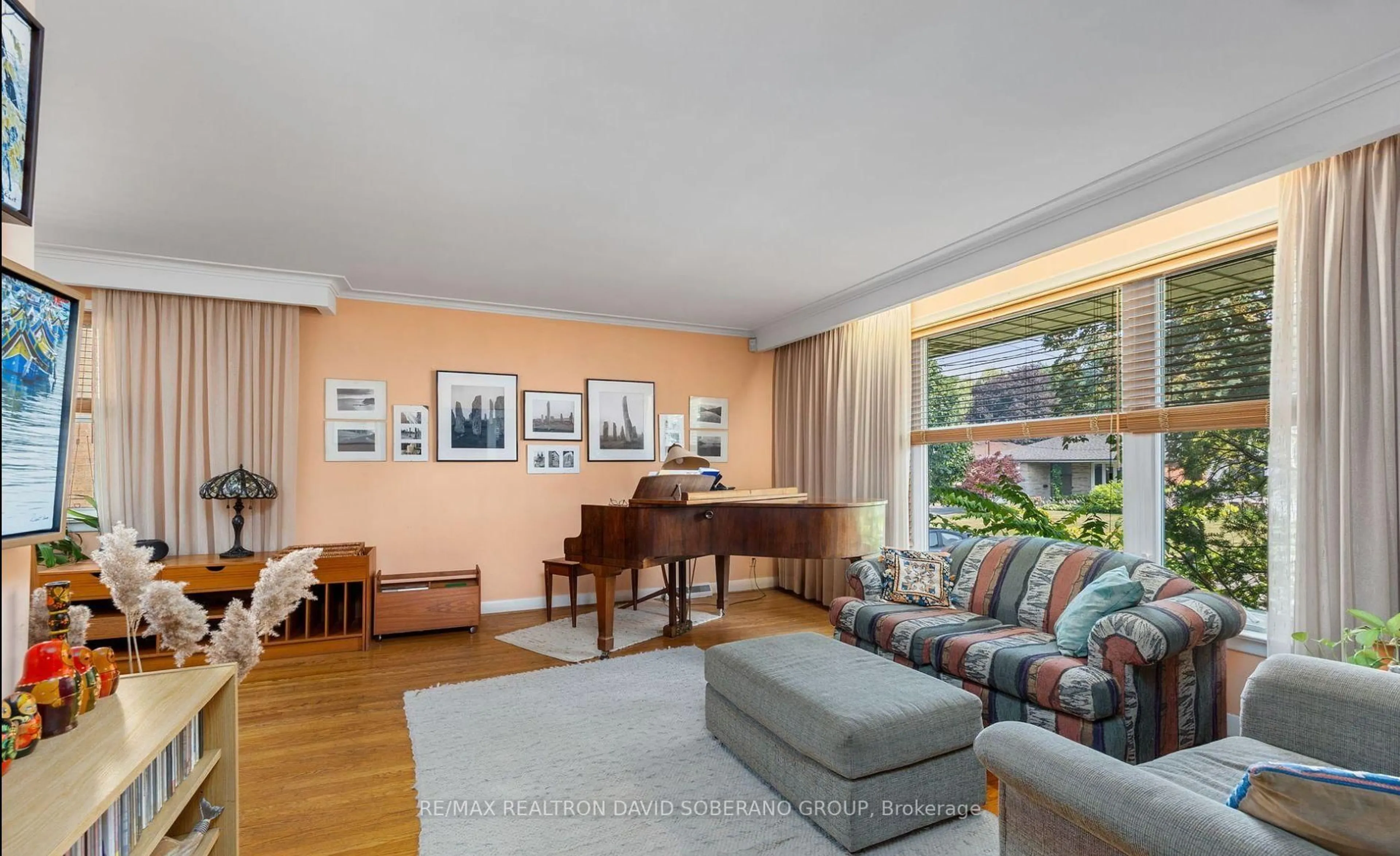 Living room with furniture, wood/laminate floor for 29 Artreeva Dr, Toronto Ontario M3H 4T7