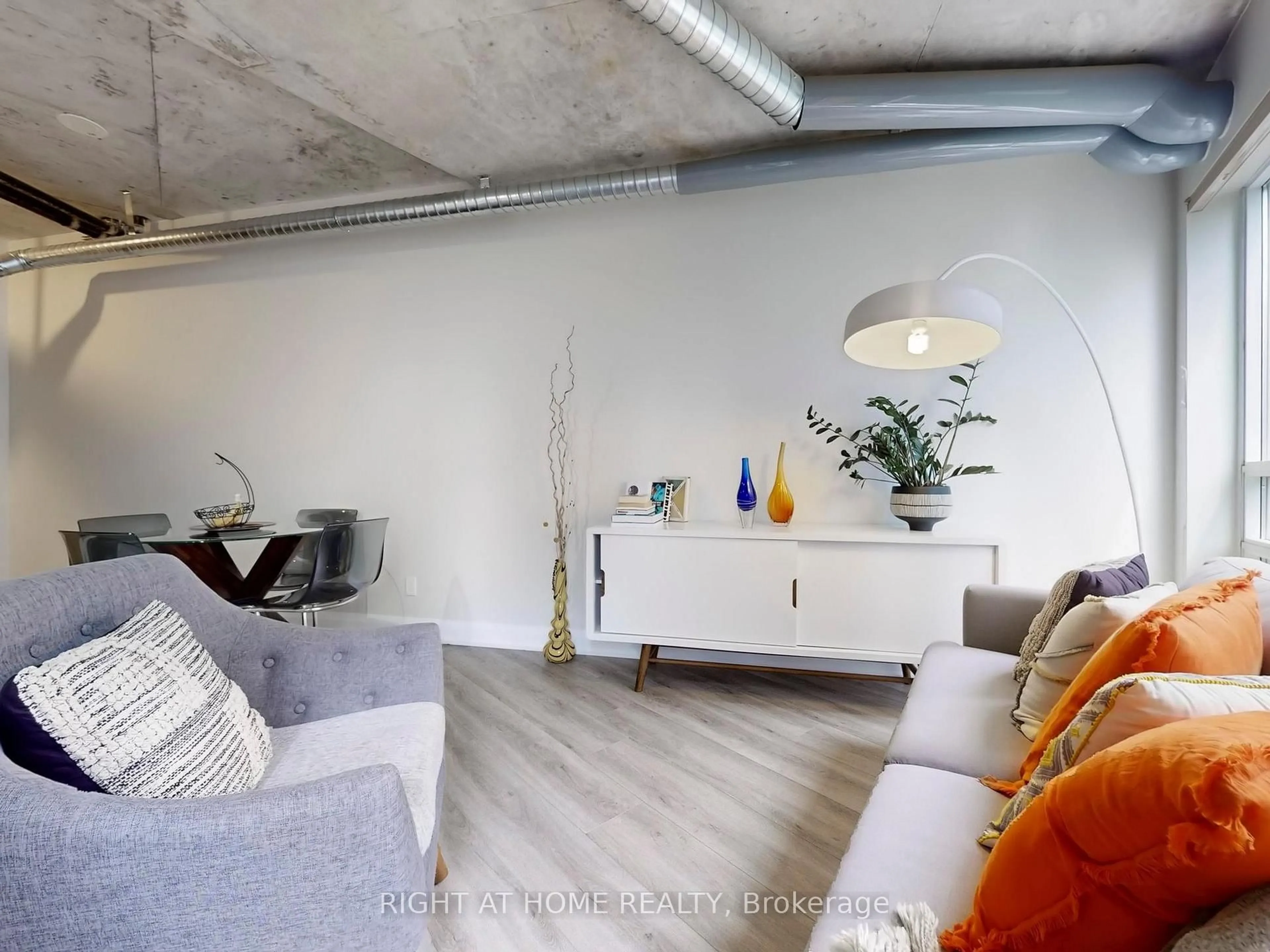Living room with furniture, cement floor for 170 Sudbury St #415, Toronto Ontario M6J 0A1