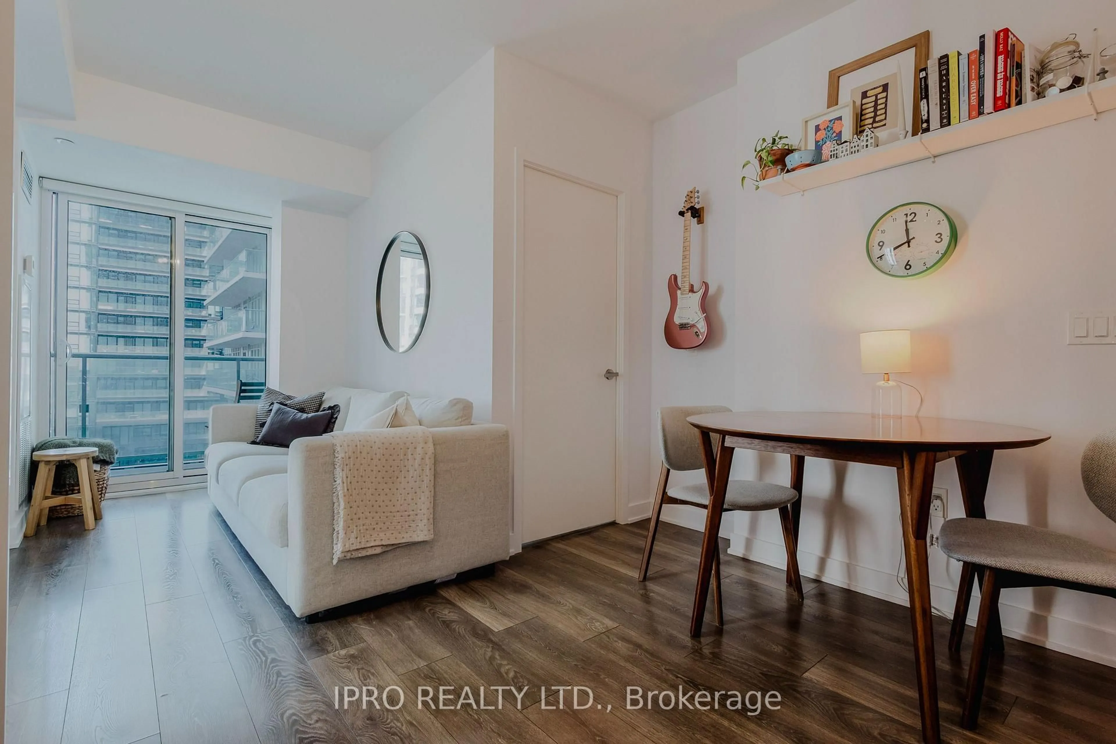 Living room with furniture, wood/laminate floor for 195 Redpath Ave, Toronto Ontario M4P 0E4