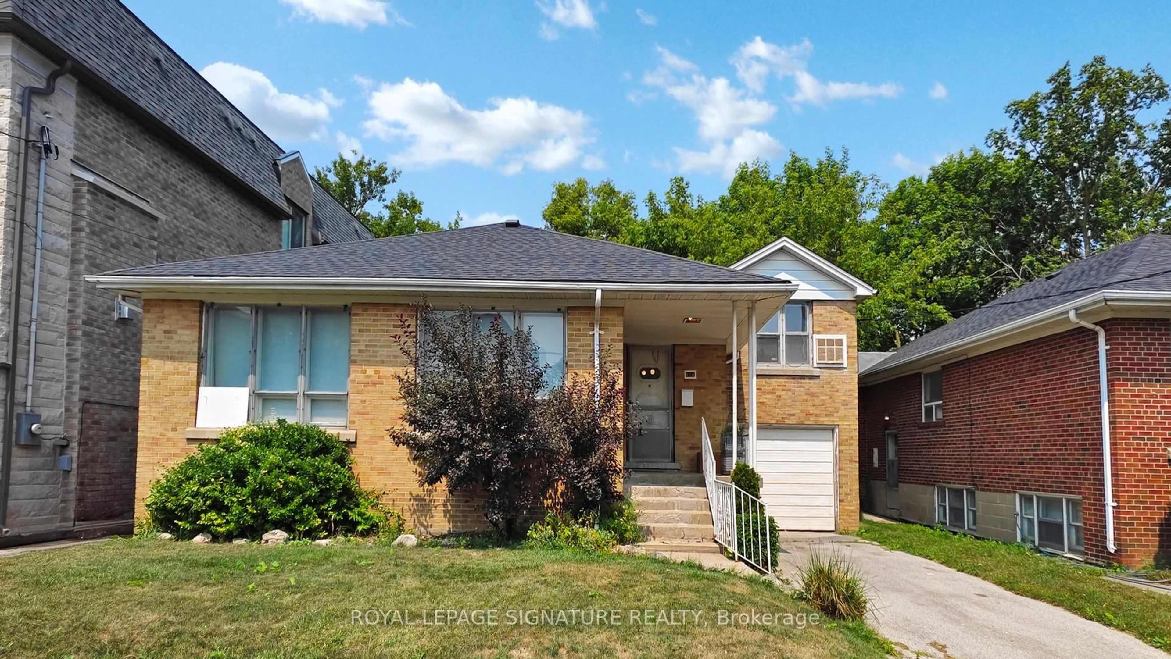 Home with brick exterior material, street for 174 Caribou Rd, Toronto Ontario M5N 2B6
