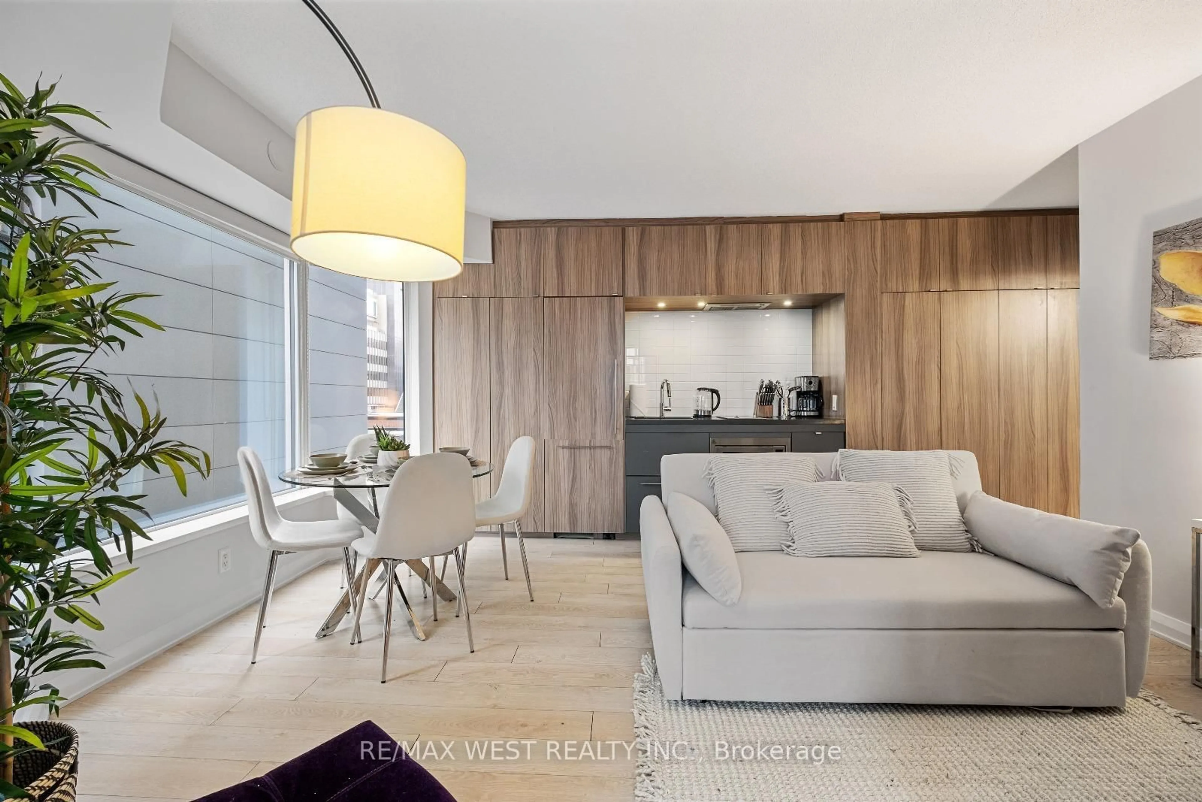 Living room with furniture, wood/laminate floor for 155 Yorkville Ave #704, Toronto Ontario M5R 0B4