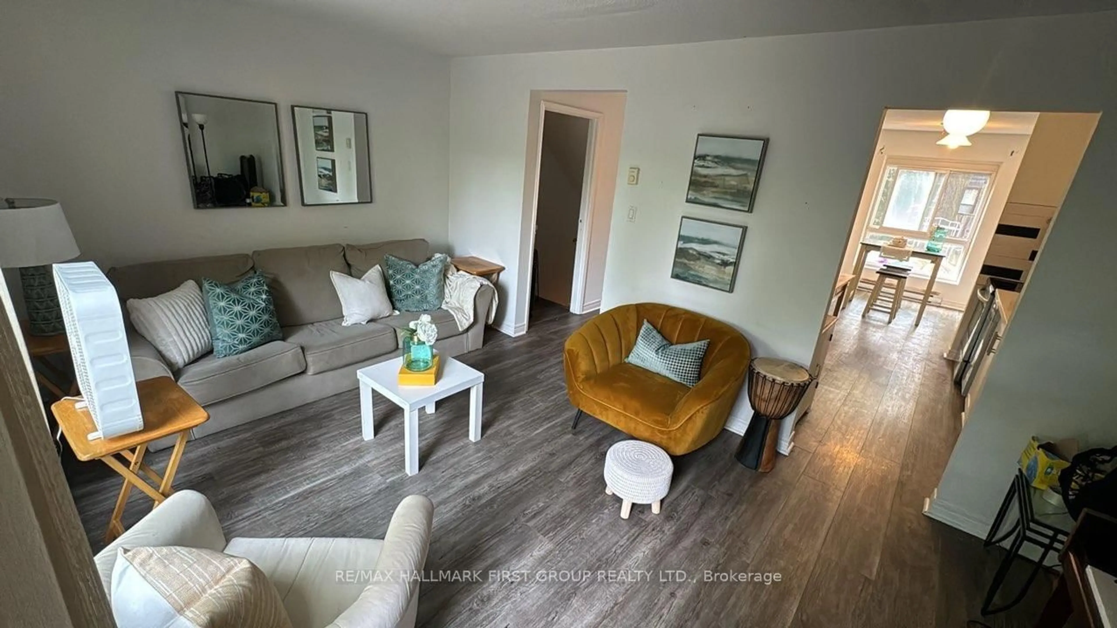 Living room with furniture, wood/laminate floor for 6 Rock Fern Way #258, Toronto Ontario M2J 4N2